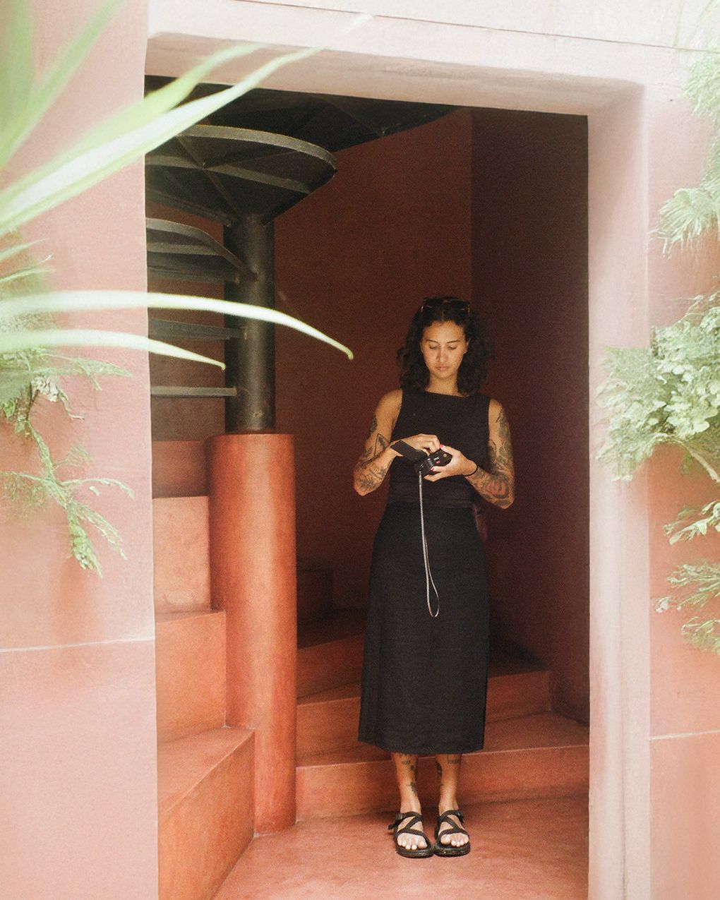 Photographer, Isabel Gloss, standing in doorway.