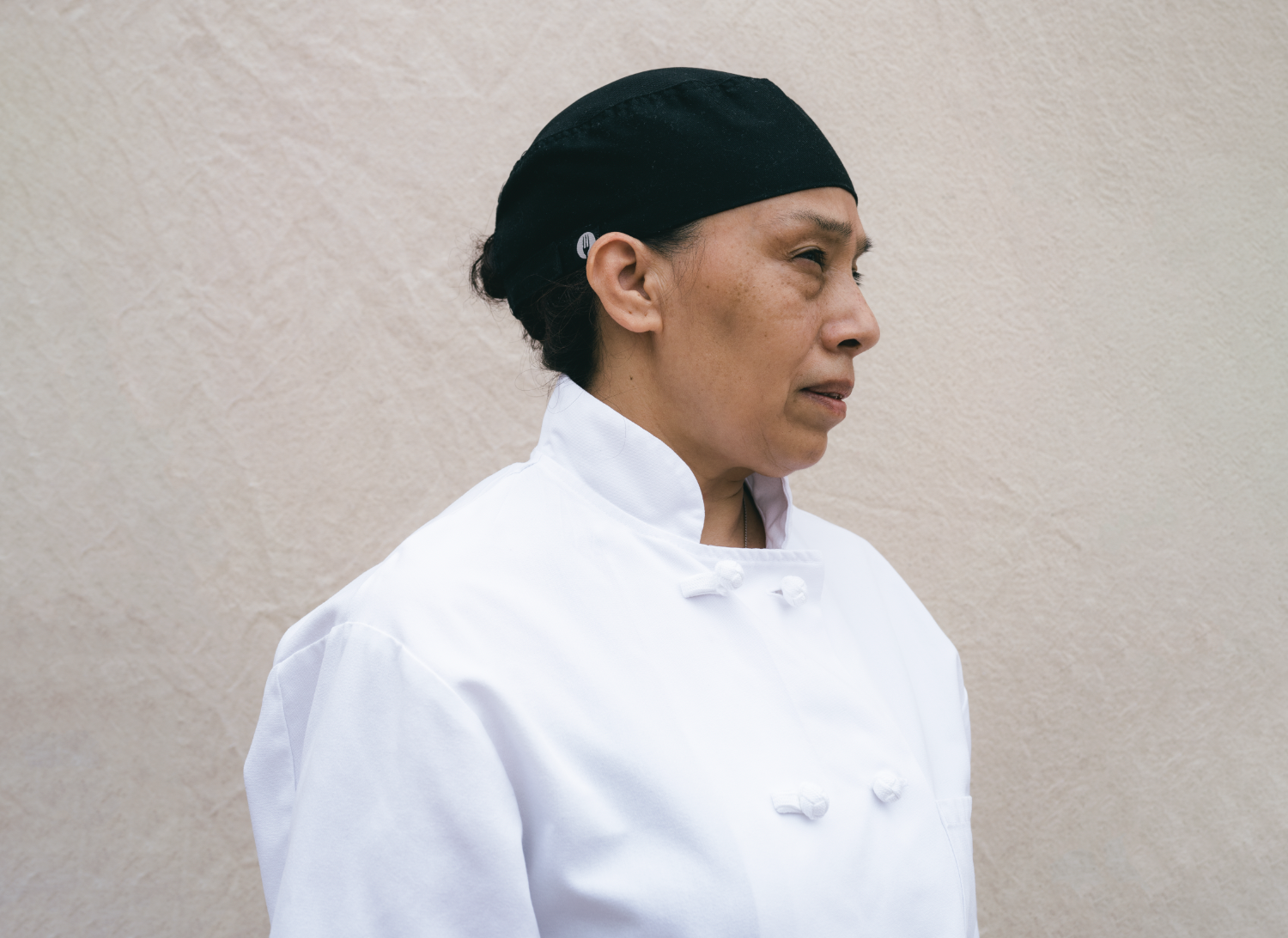 Fine art photo of a woman in chef's clothes, Our Streets Project.