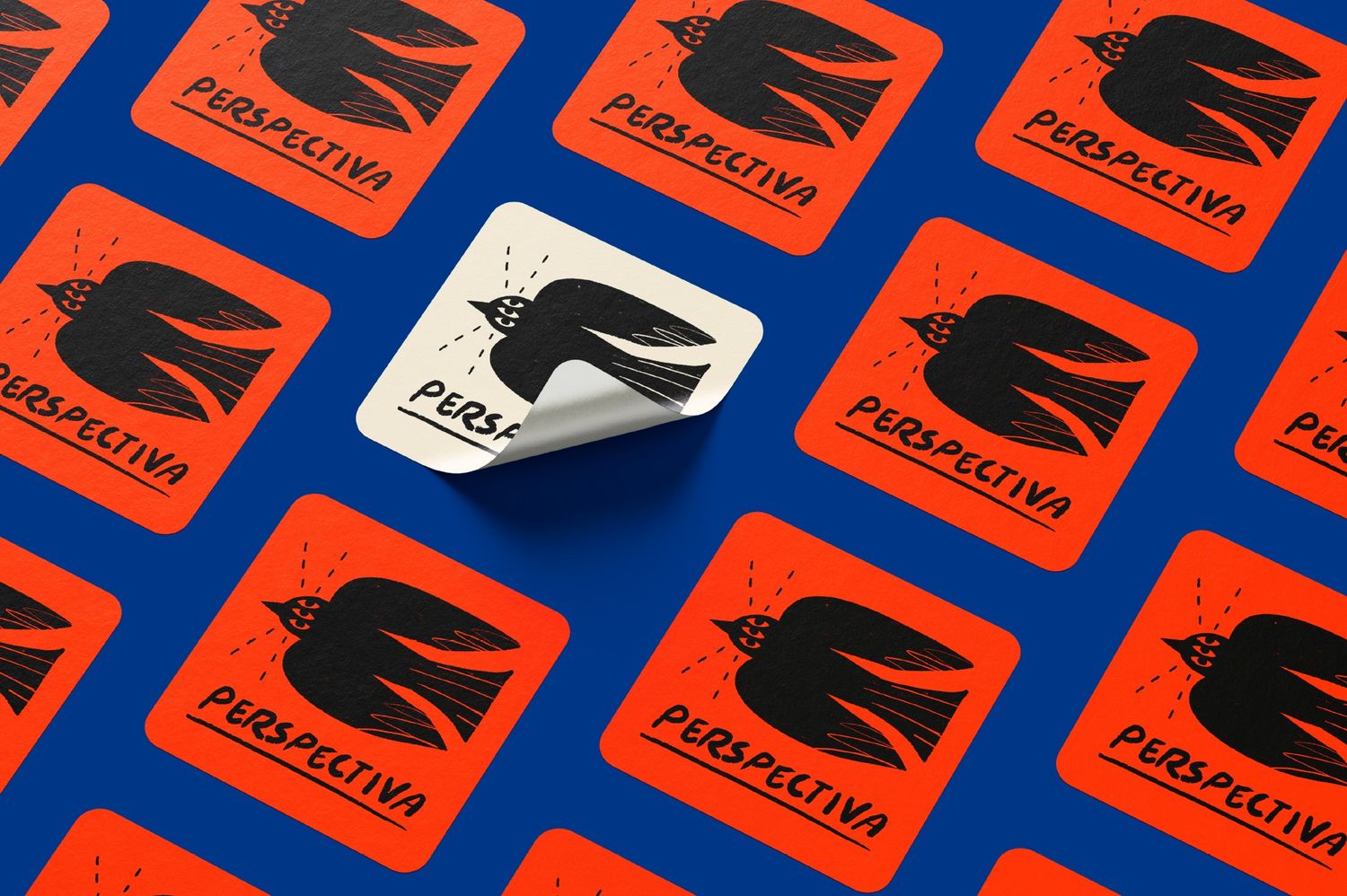 Red square stickers with black bird logo and Perspectiva branding arranged on blue background, one white sticker peeling up.