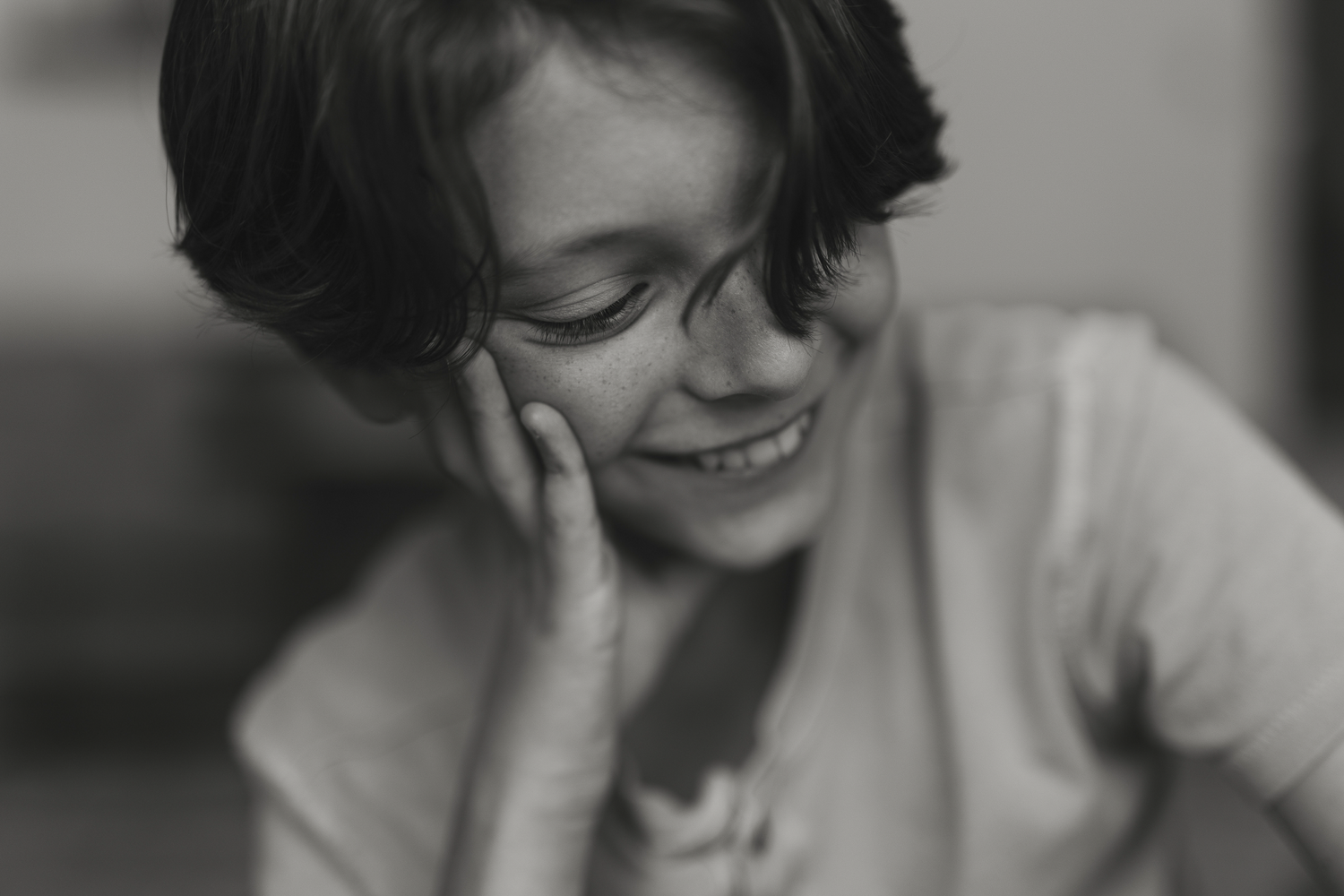 candid boy smiling in black and white cherry hill