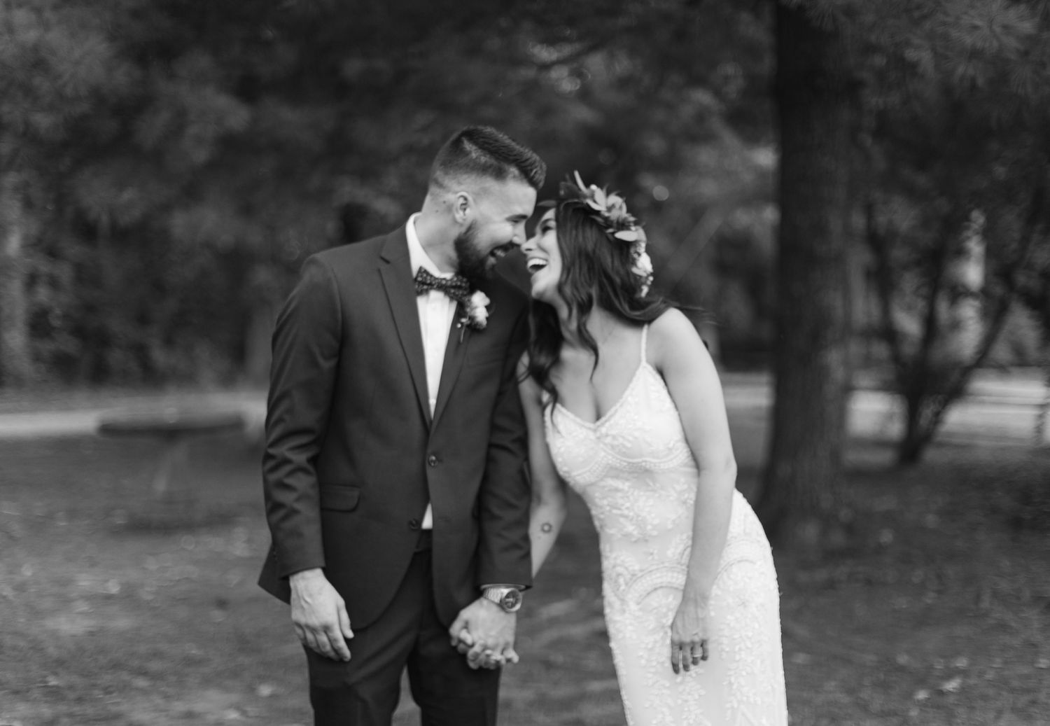 Candid black and white wedding image of bride and groom laughing documentary wedding photography South Jersey