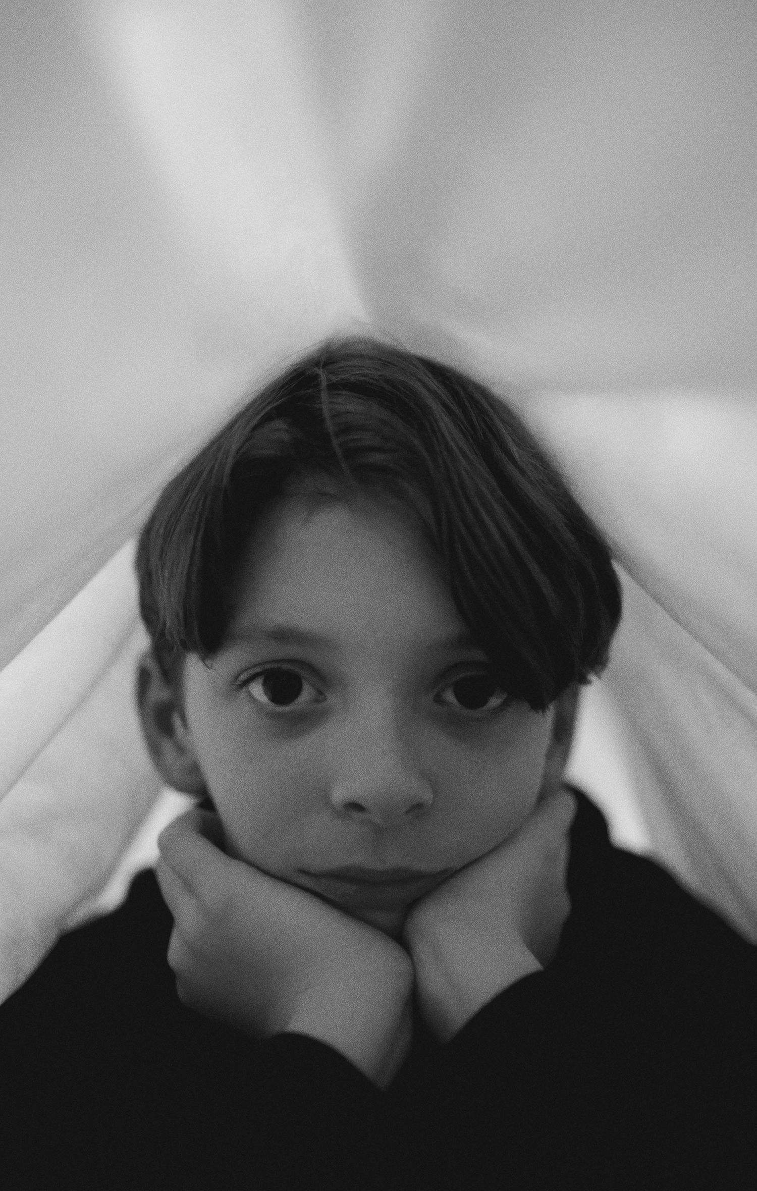 Moody black and white self-portraits showing different angles and emotions.