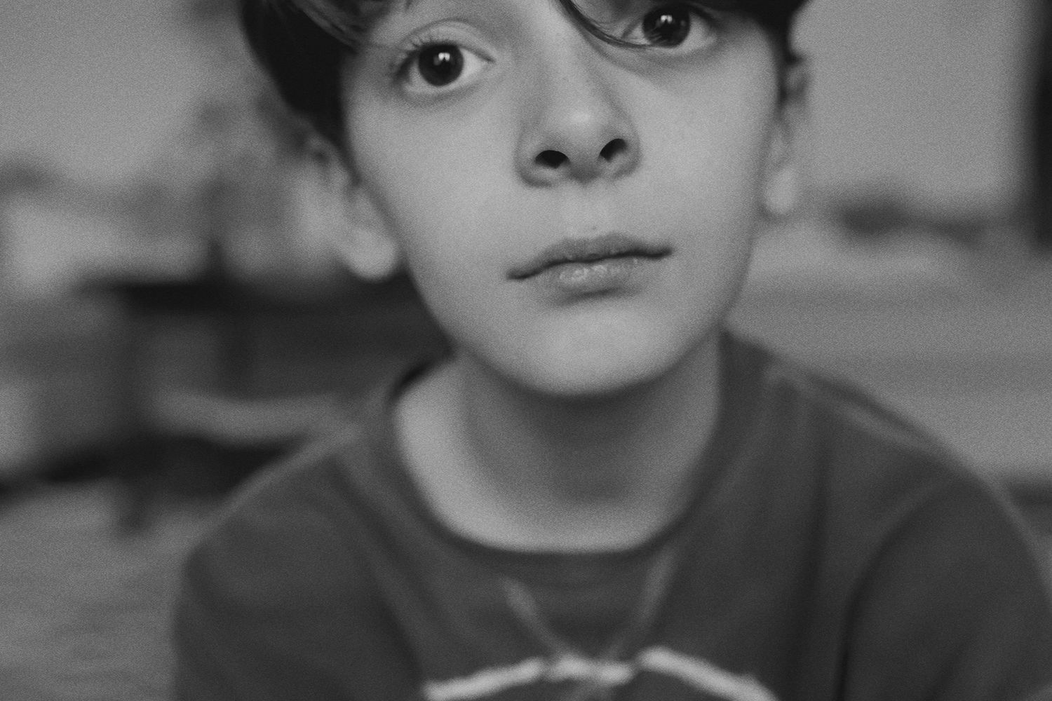 A black and white close-up portrait series showing expressive eyes and facial features.