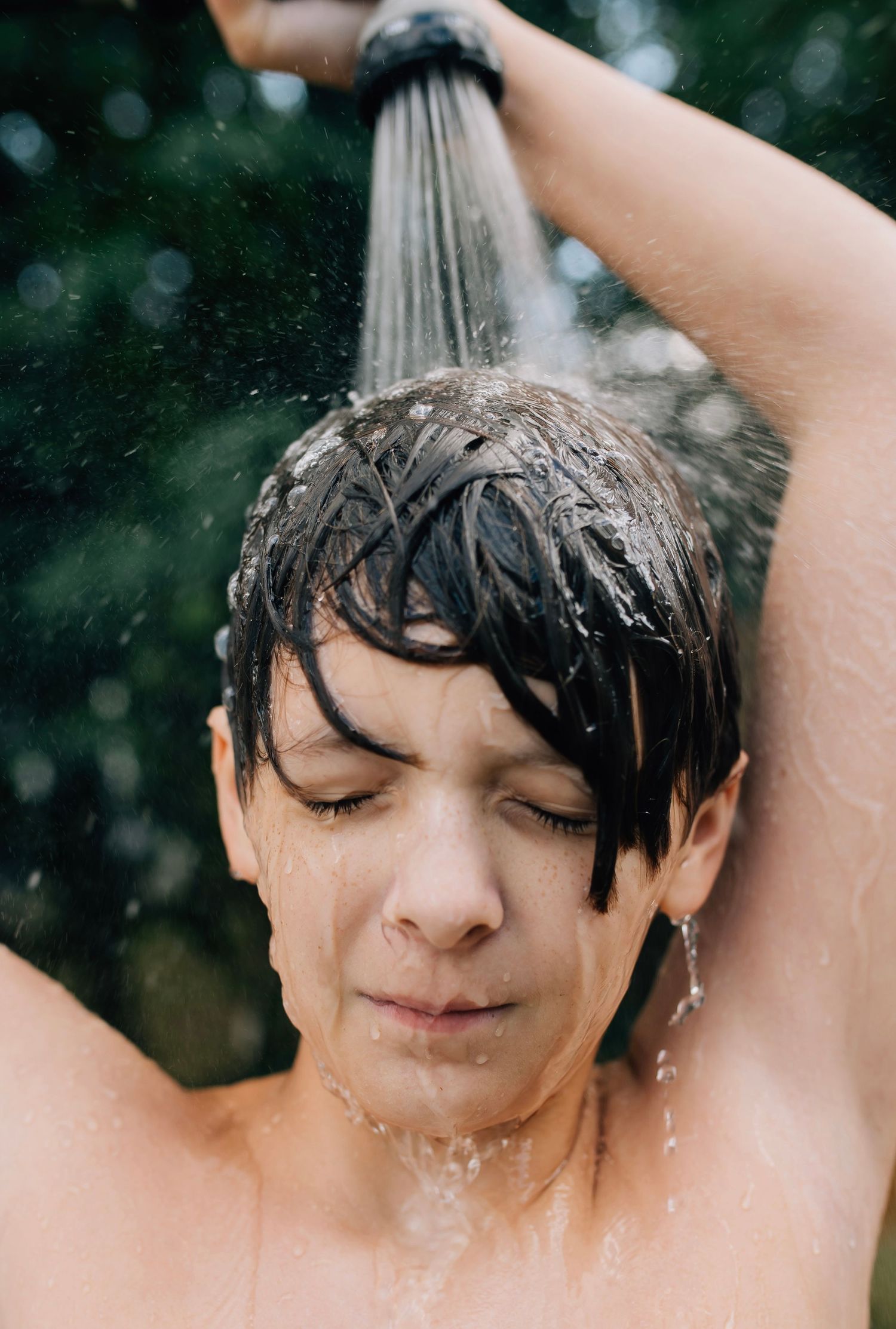 Water droplets splash around during summer outdoor play.