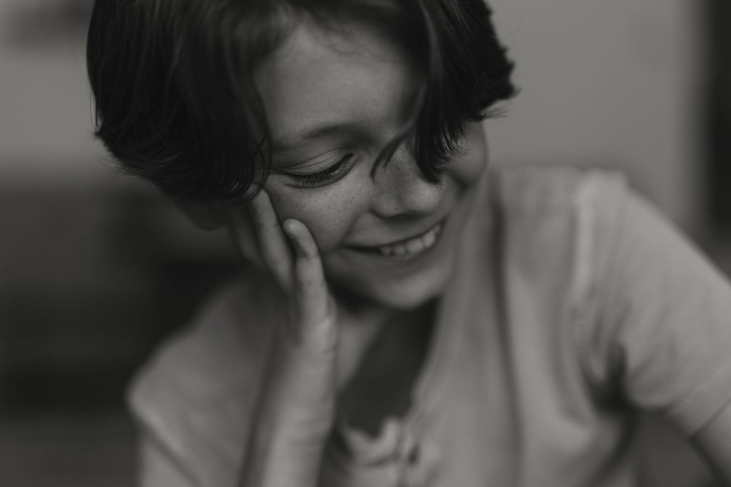 Black and white portraits showing joyful expressions and natural moments.