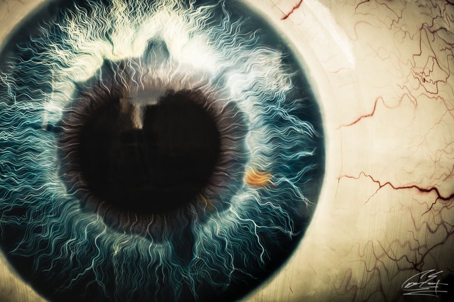 Detailed digital art illustration of a human eyeball with vivid blue iris and red veins.