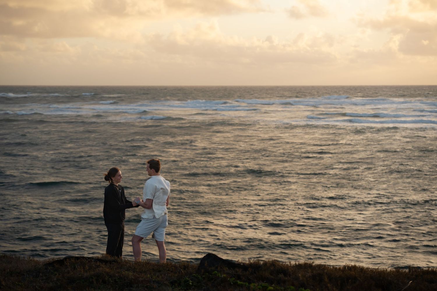St Lucia proposal captured by wedding photographer-videographer, showing emotional surprise engagement moment between couple at sunrise