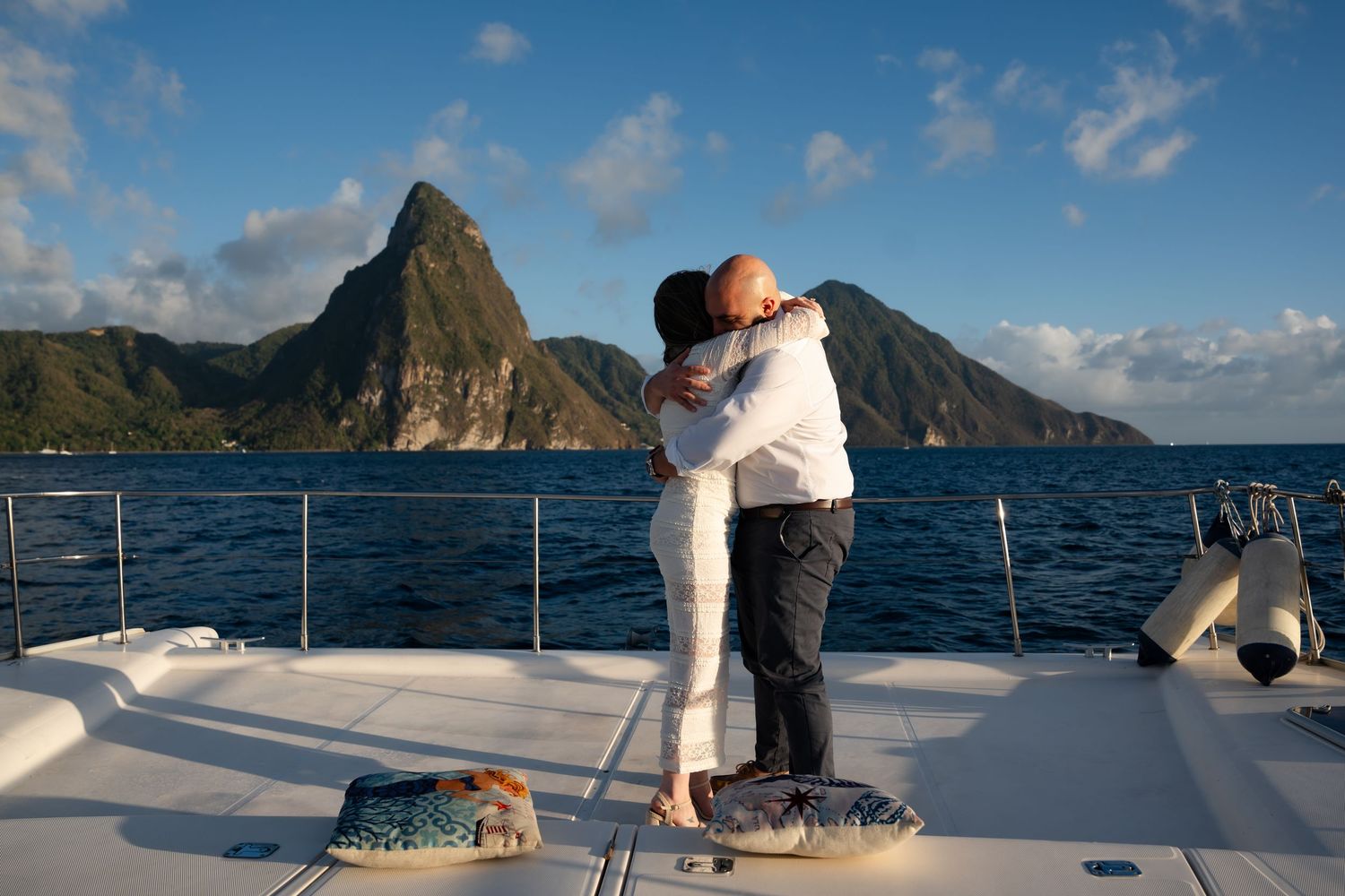 St Lucia proposal captured by wedding photographer-videographer, showing emotional surprise engagement moment between couple at sunset
