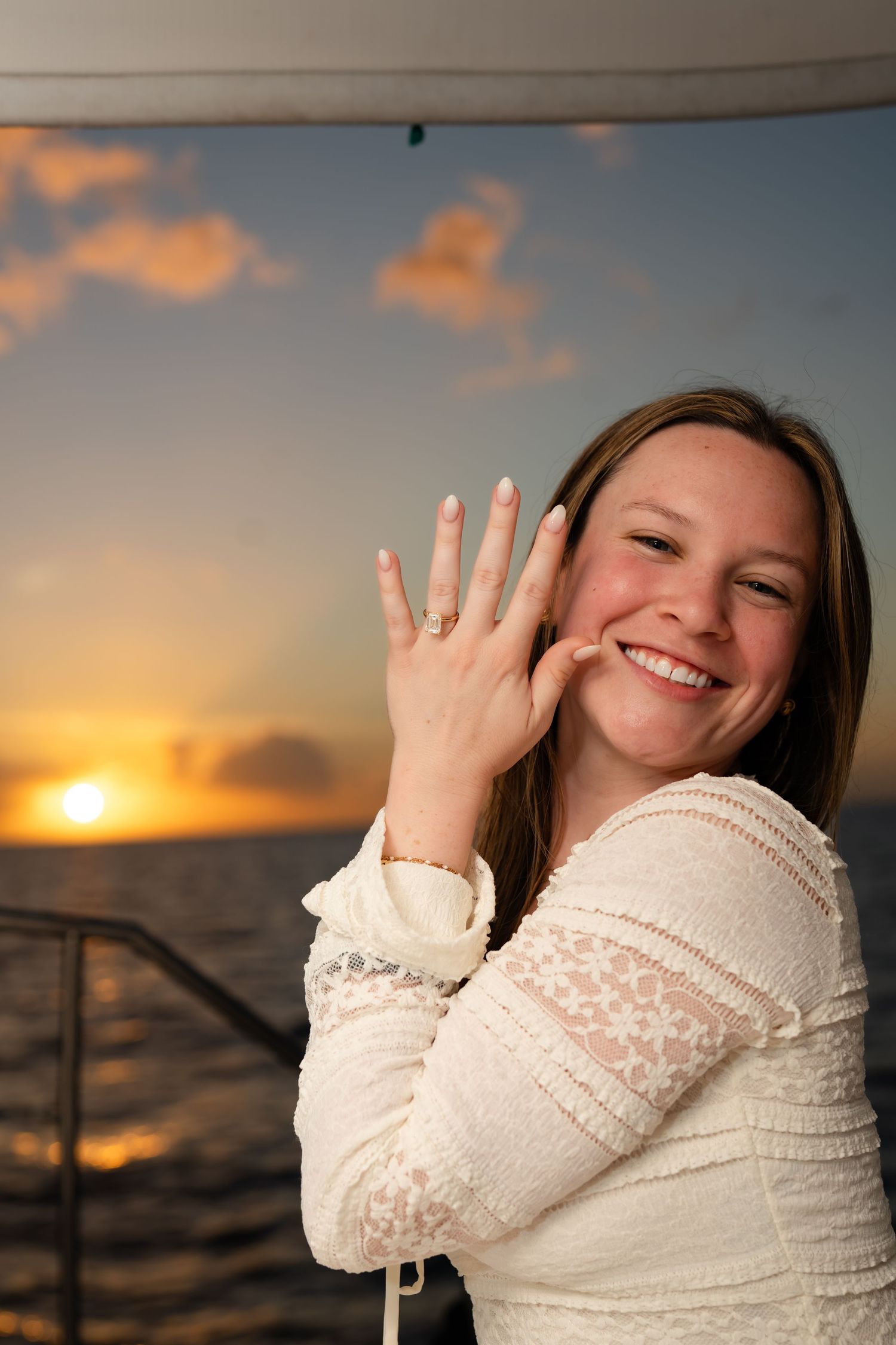 St Lucia proposal captured by wedding photographer-videographer, showing emotional surprise engagement moment between couple at sunset