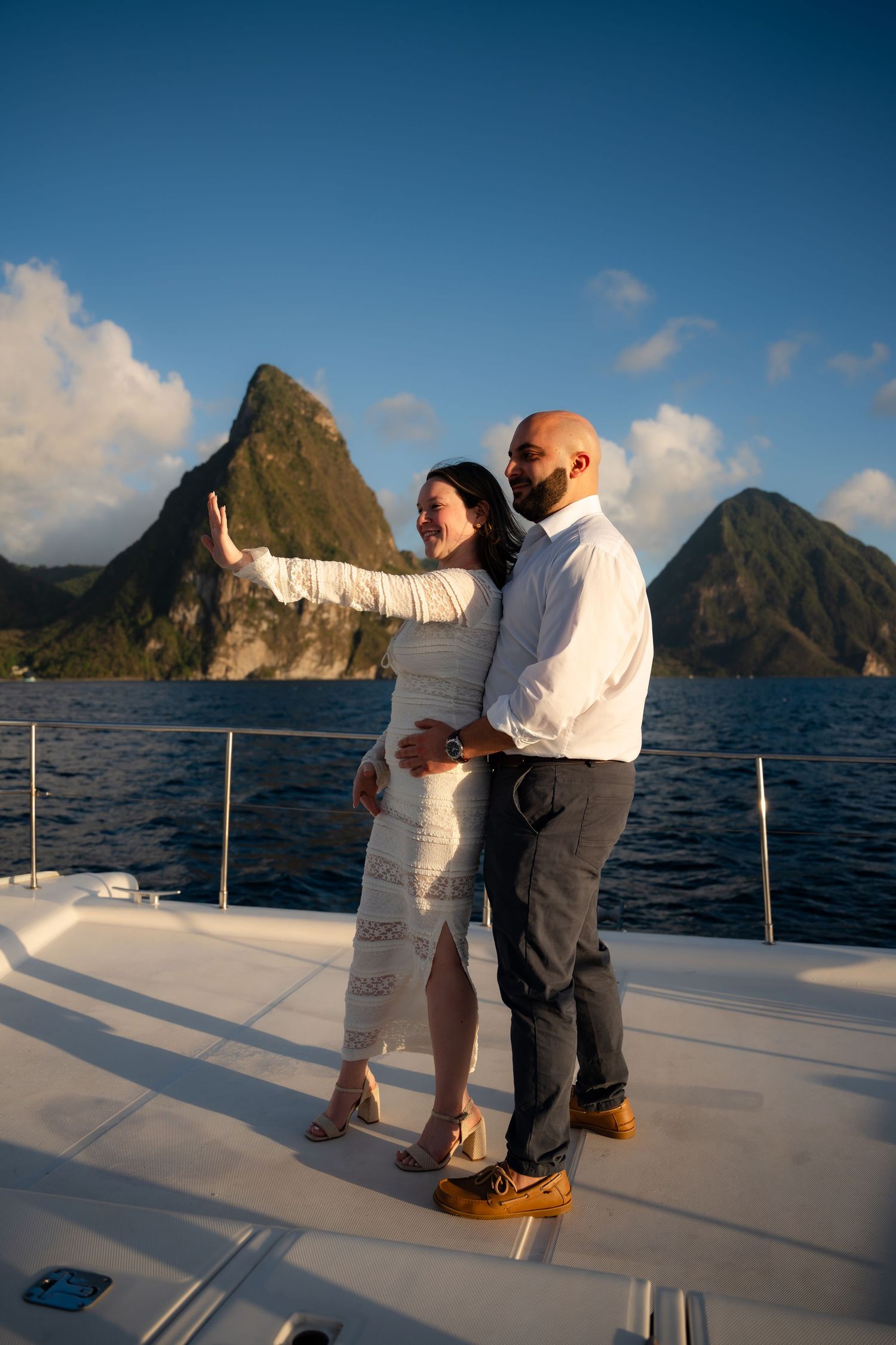 St Lucia proposal captured by wedding photographer-videographer, showing emotional surprise engagement moment between couple at sunset