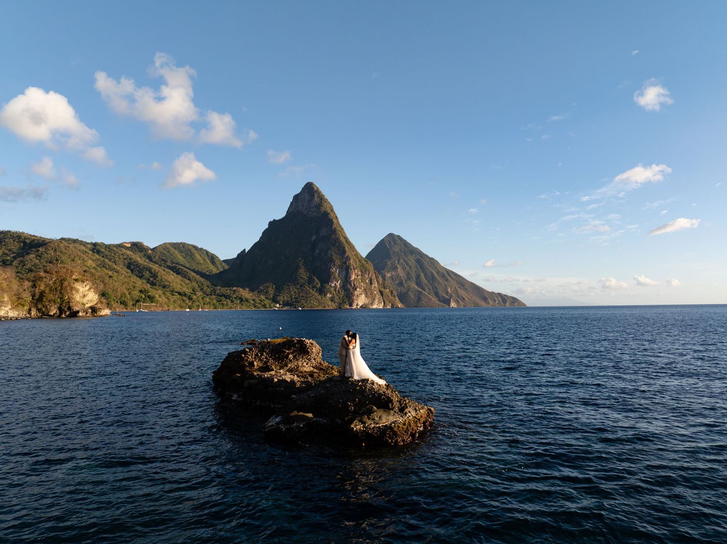 Happy wedding couple in St Lucia during couples photoshoot, capturing real emotion, connection, and authentic moments together at Pitons
