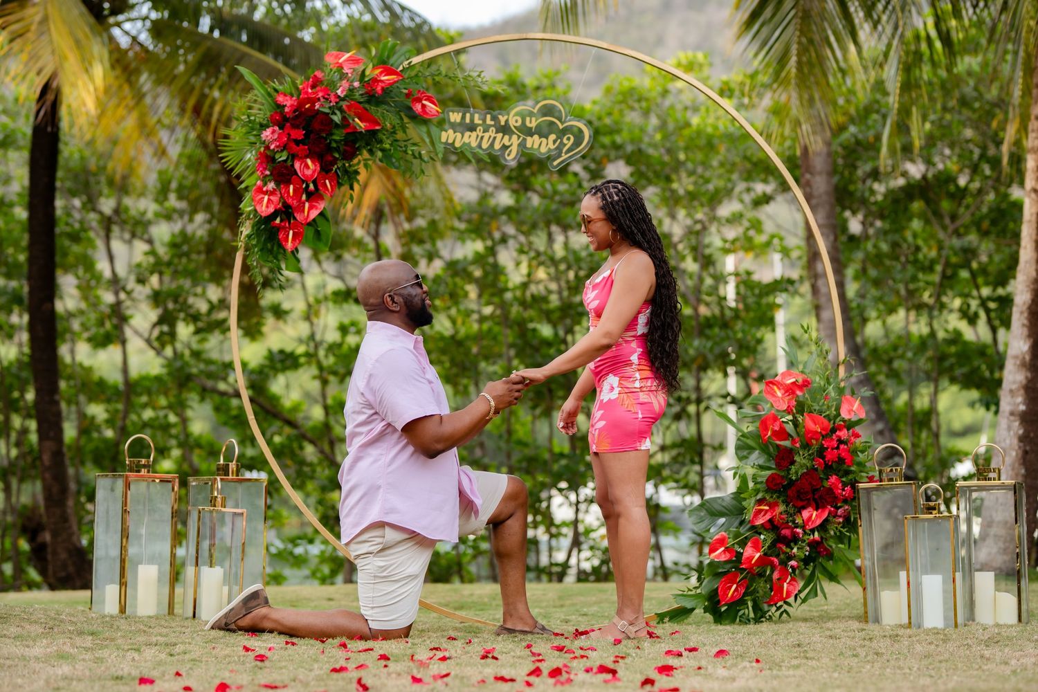 St Lucia beach proposal captured by wedding photographer-videographer, showing emotional surprise engagement moment between couple at sunset
