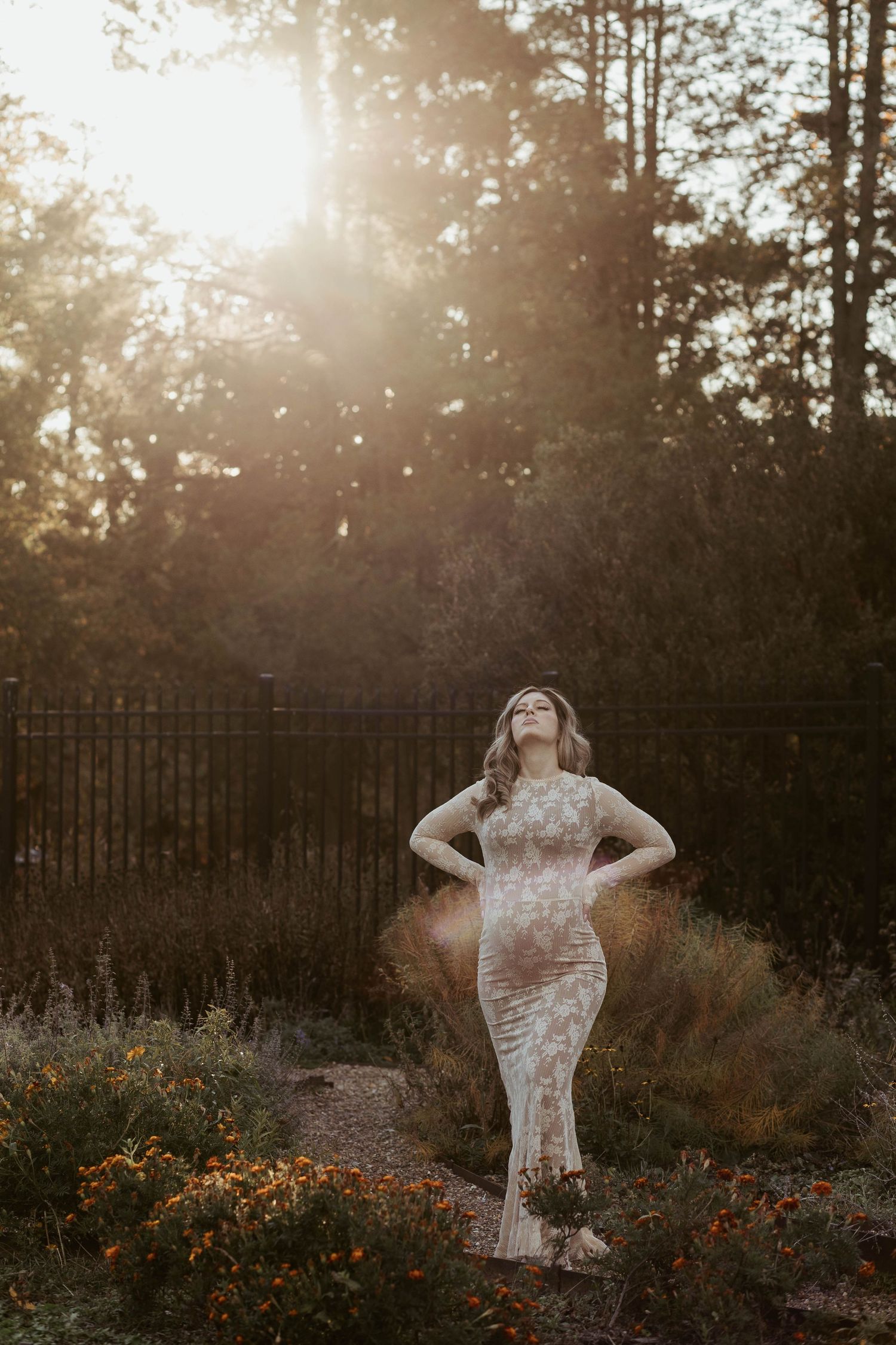 maternity photo of a woman standing in the moody sun, hartwood acres, pittsburgh pennsylvania
