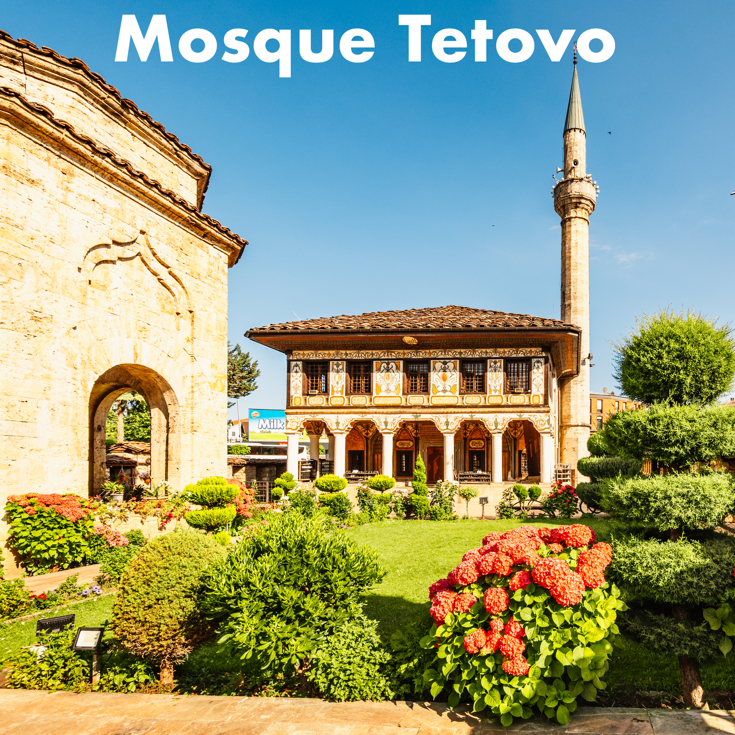 The ornate Painted Mosque of Tetovo with minaret and colorful gardens in North Macedonia.