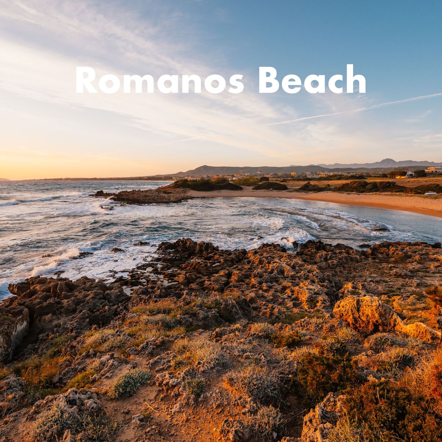 Golden sunset view of Romanos Beach in Greece, with rocky shoreline and calm ocean waves.