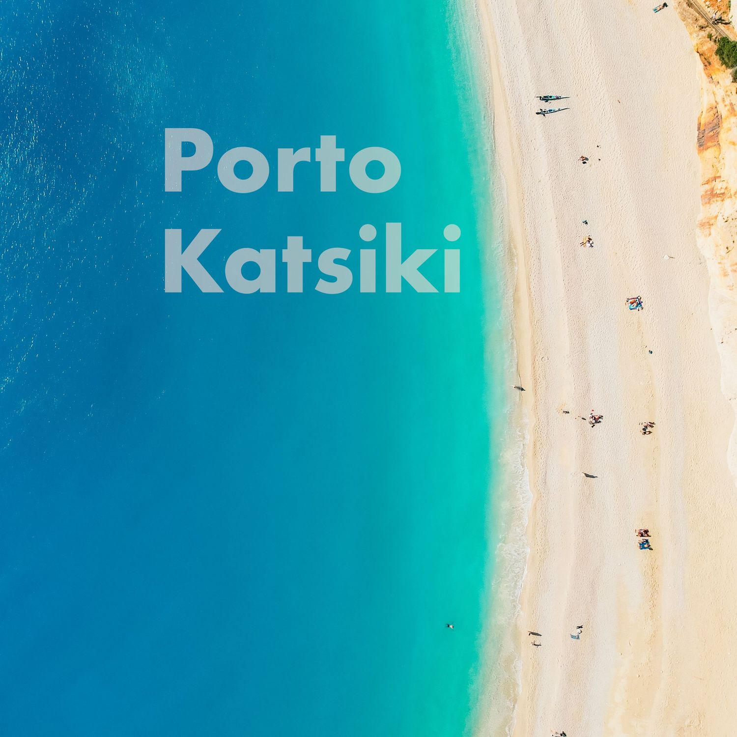 Aerial view of Porto Katsiki beach in Greece with bright turquoise water and white sandy shoreline.