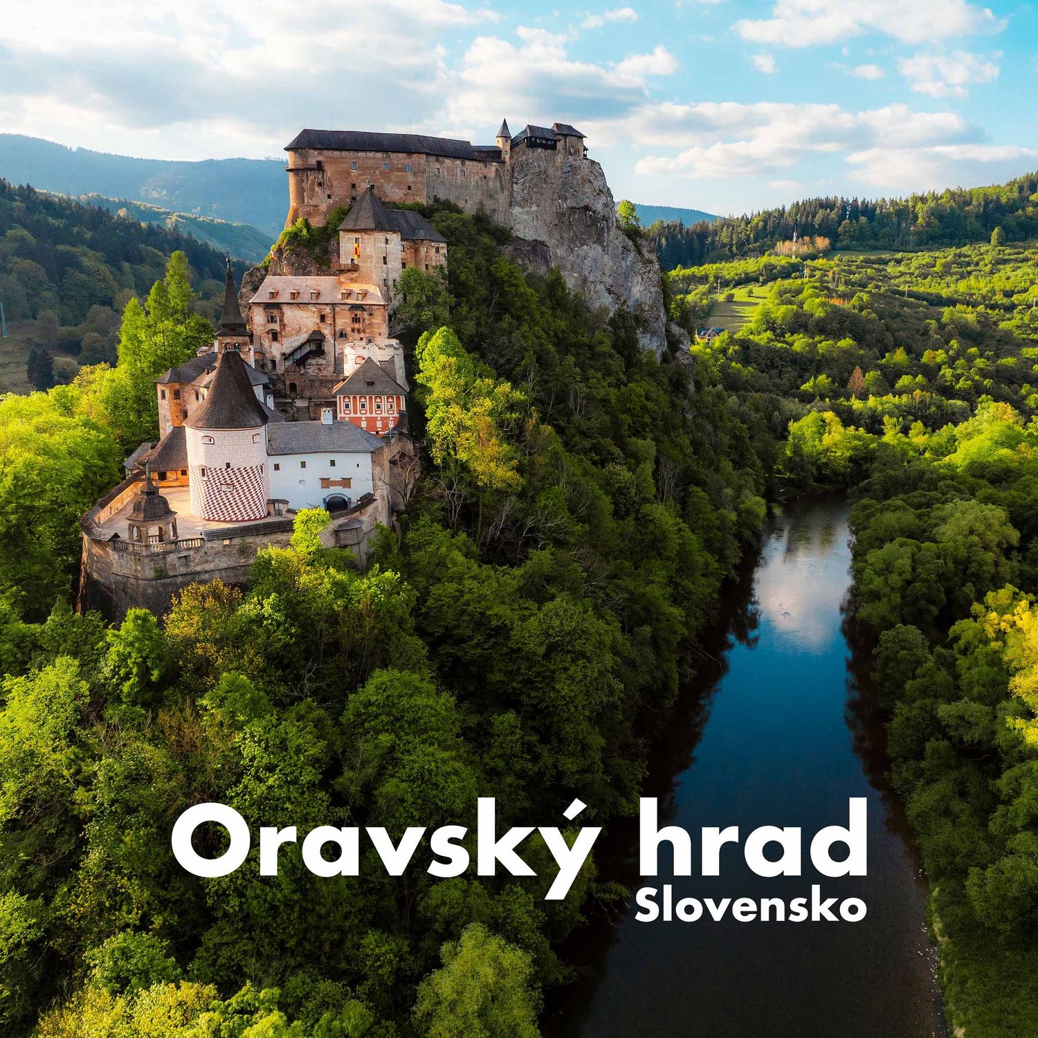 Aerial view of medieval Oravsky hrad castle on a forested hilltop in Slovakia.