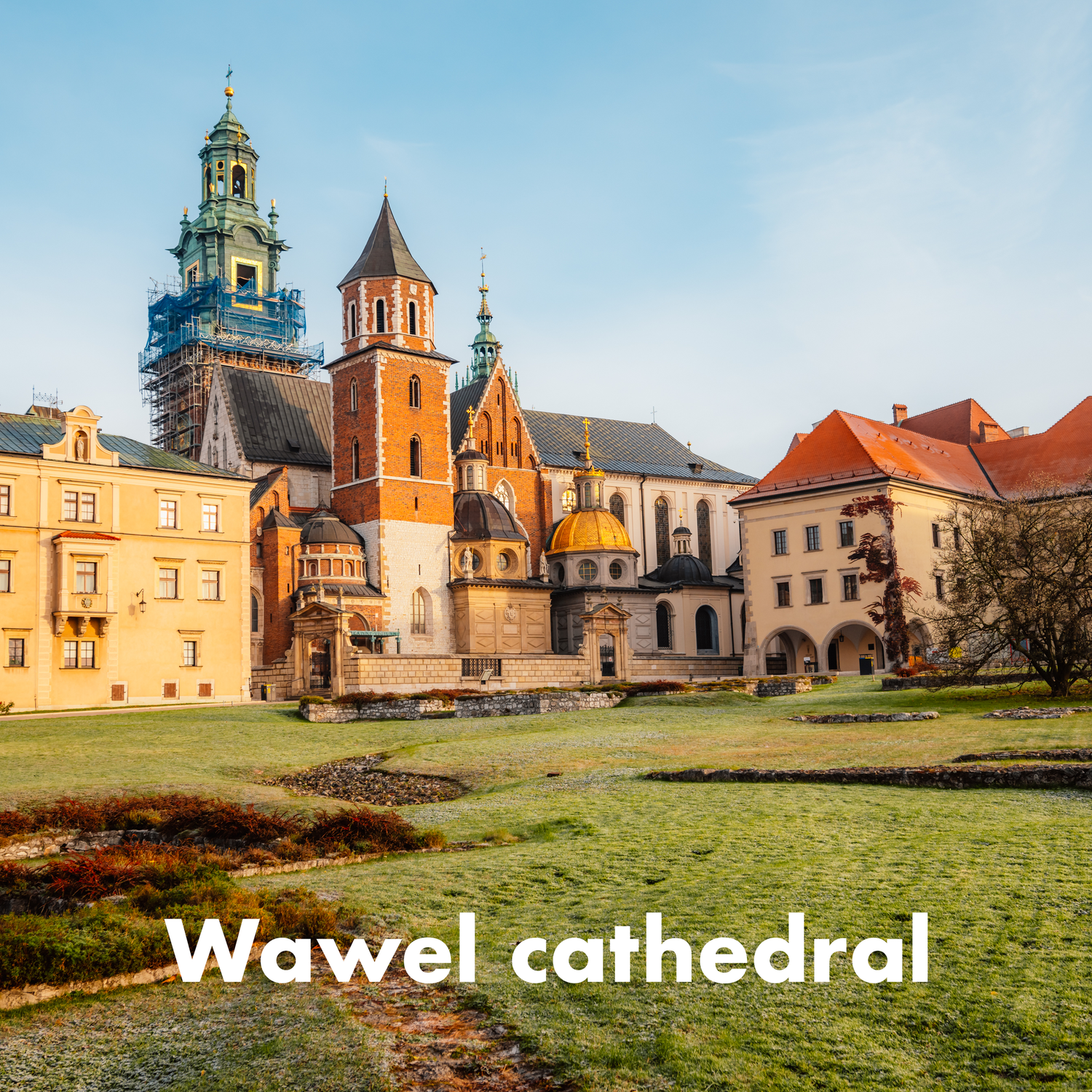 Wawel Cathedral in Krakow, Poland, featuring Gothic and Renaissance architecture with colorful facades and green lawns.