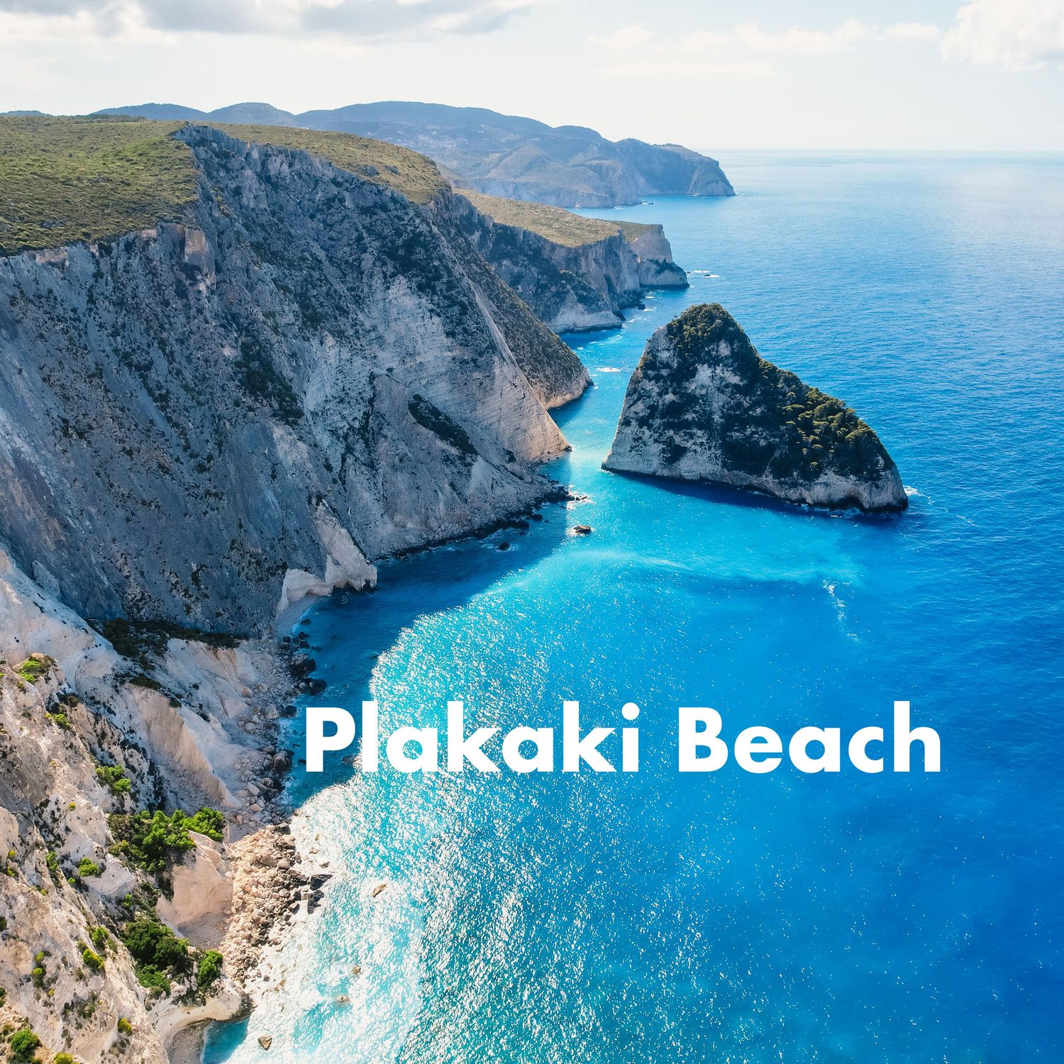 Aerial view of Plakaki Beach in Greece, featuring dramatic limestone cliffs and vivid turquoise waters.