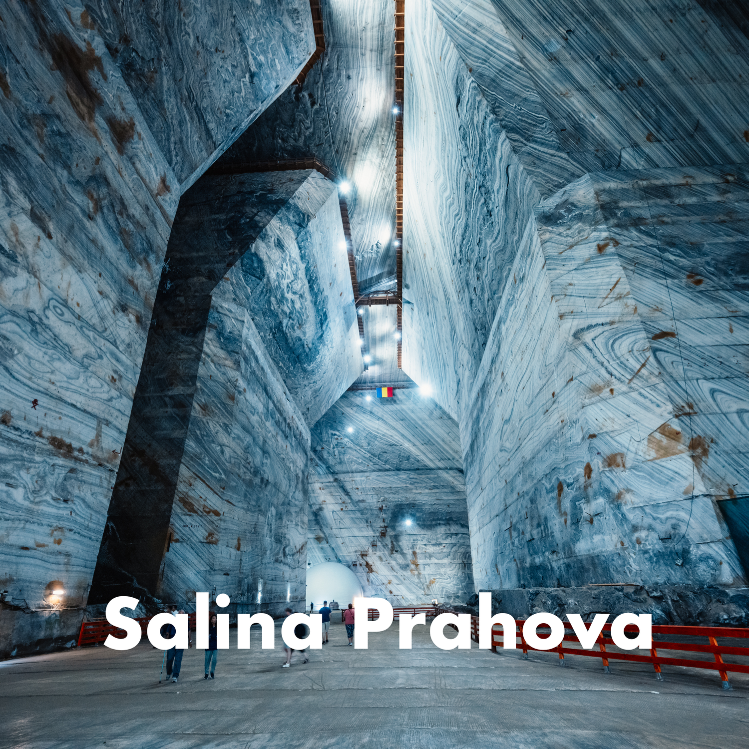 Vast underground salt mine cavern with dramatic layered walls at Salina Prahova, Romania.