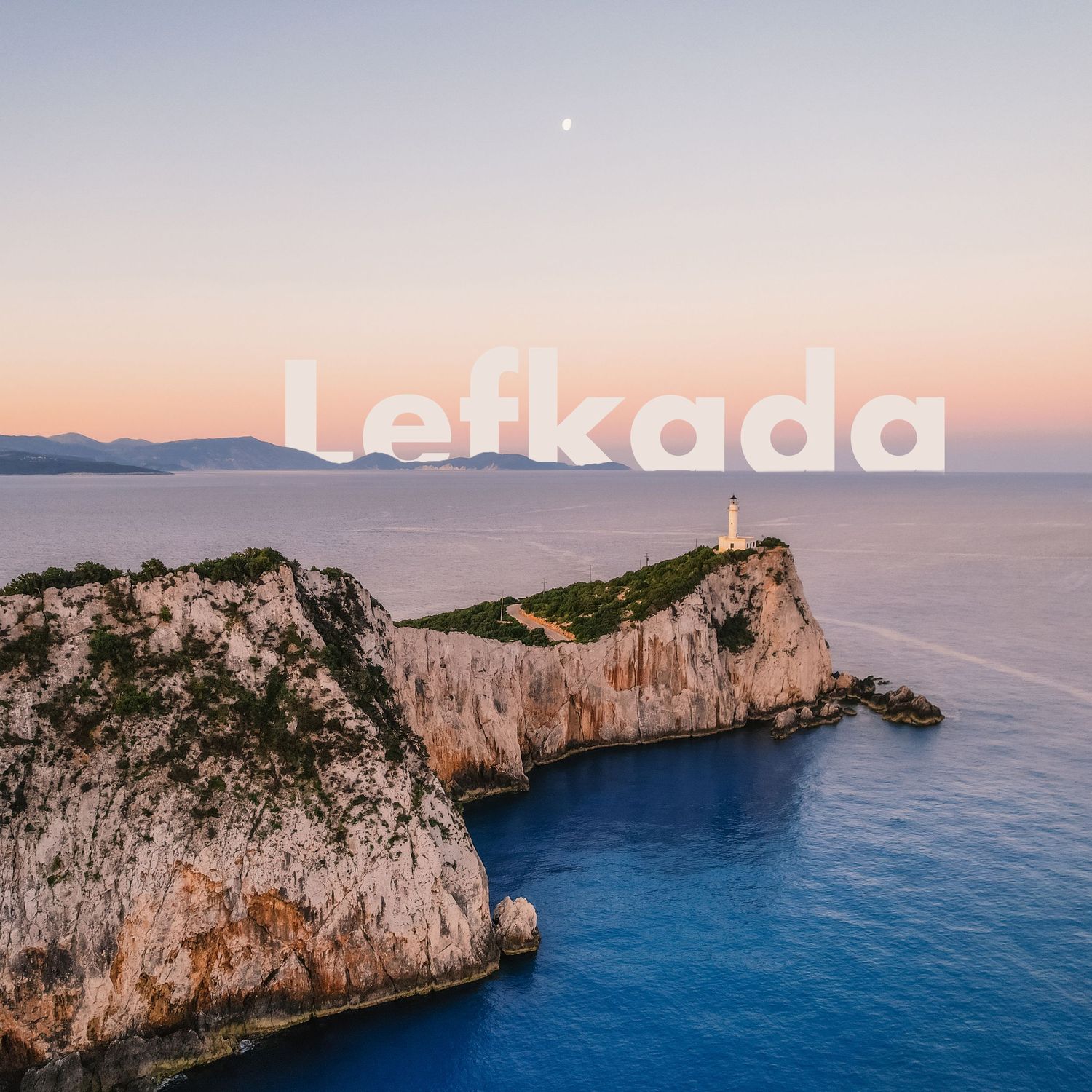 Scenic sunset view of a rocky cape in Lefkada, Greece, with a lighthouse and calm blue sea.