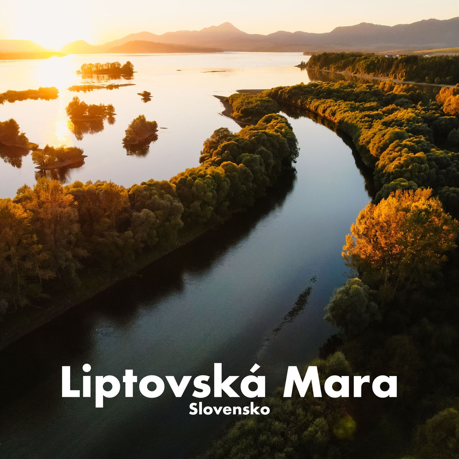 Aerial sunset view of Liptovska Mara reservoir in Slovakia with winding river and golden autumn trees.