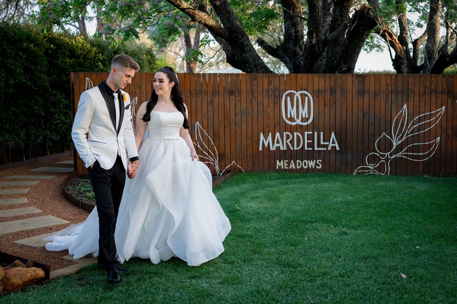 Wedding venue signage and decorations at Mardella Meadows outdoor location.