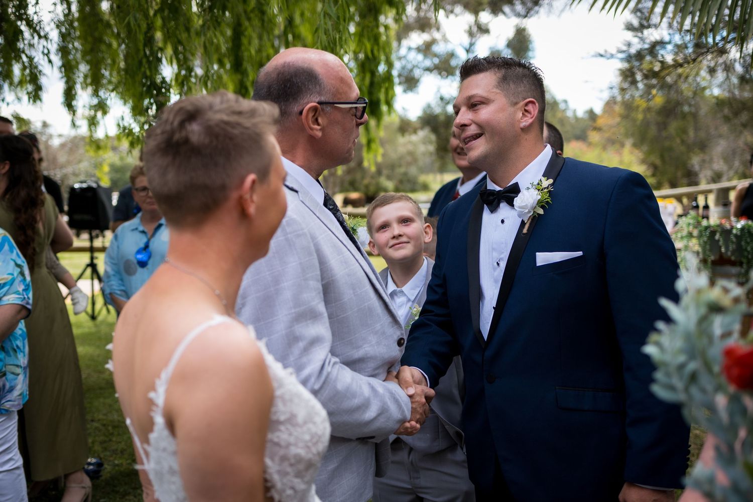 Wedding celebration candid moments captured in a lush garden setting.