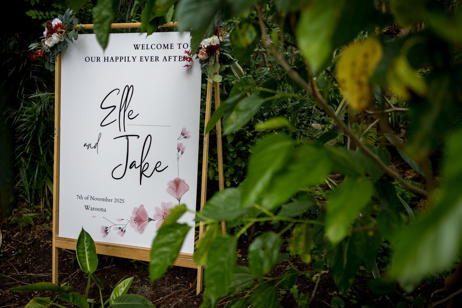 Elegant wedding welcome sign for Elle and Jake decorated with floral accents.