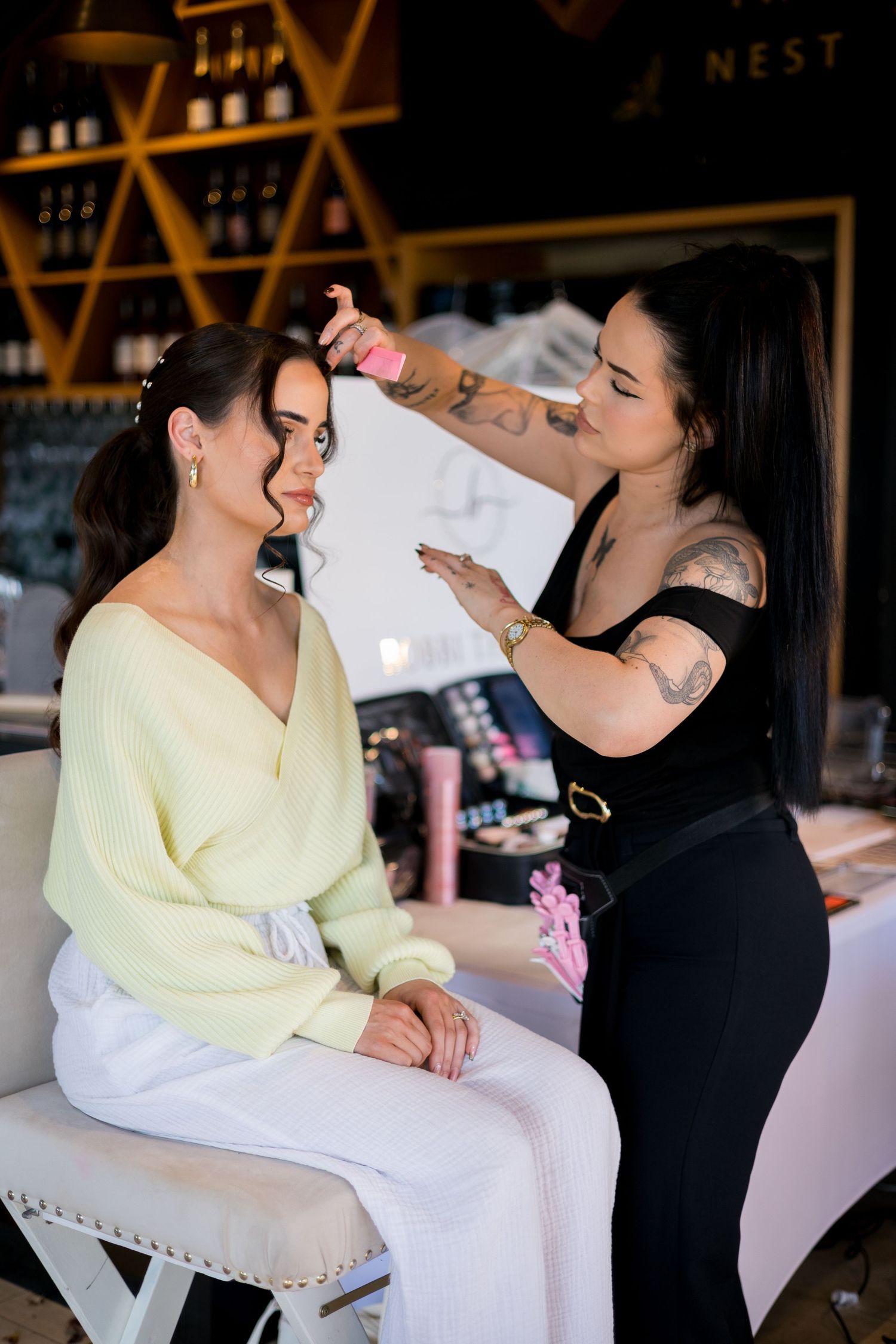 Two people share a joyful moment during wedding preparations.