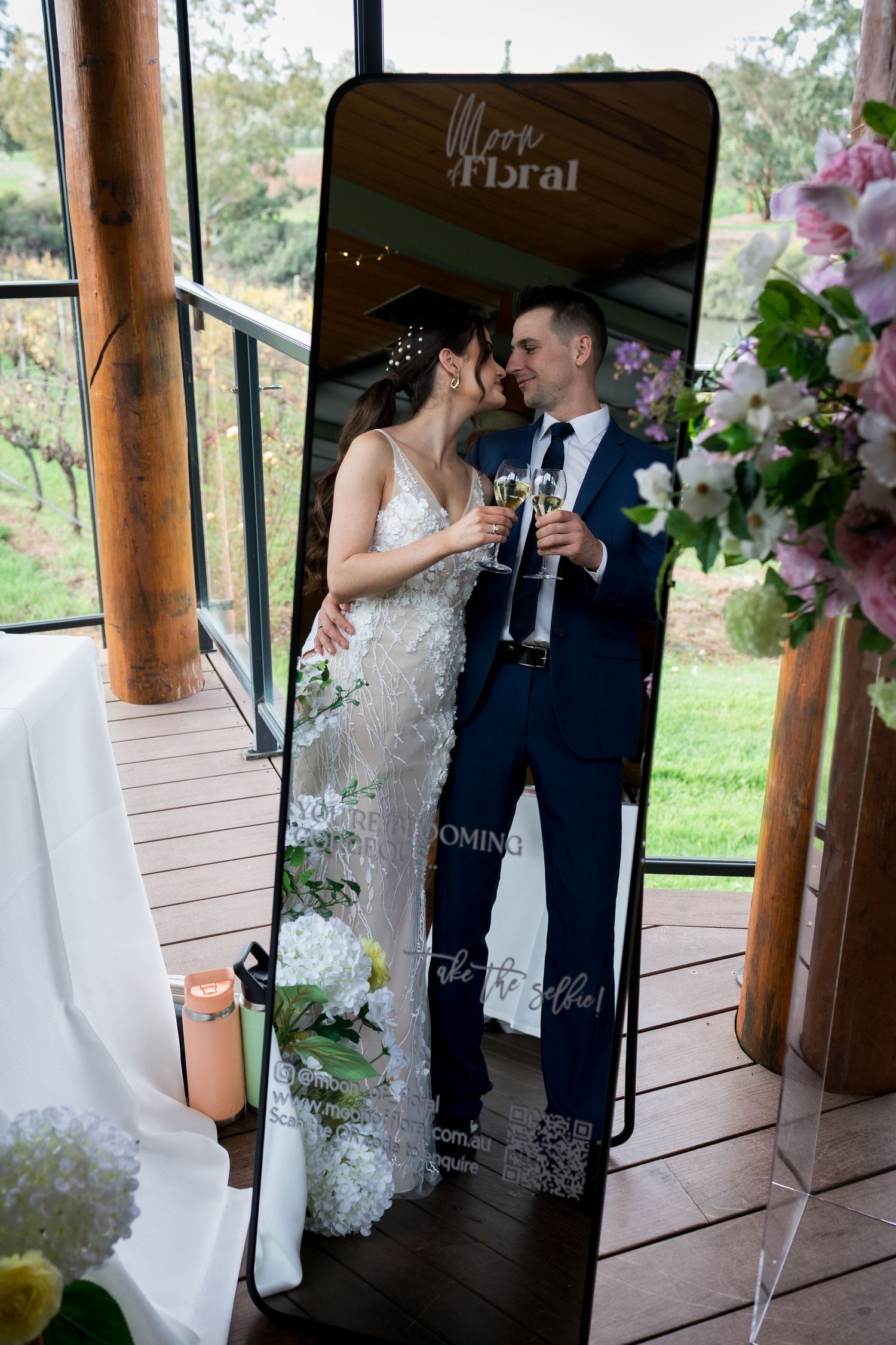 Wedding couple shares an intimate moment in a rustic wooden gazebo.