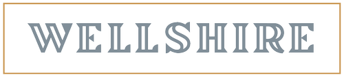 Wellshire brand logo displayed in elegant serif typography with a decorative border frame.