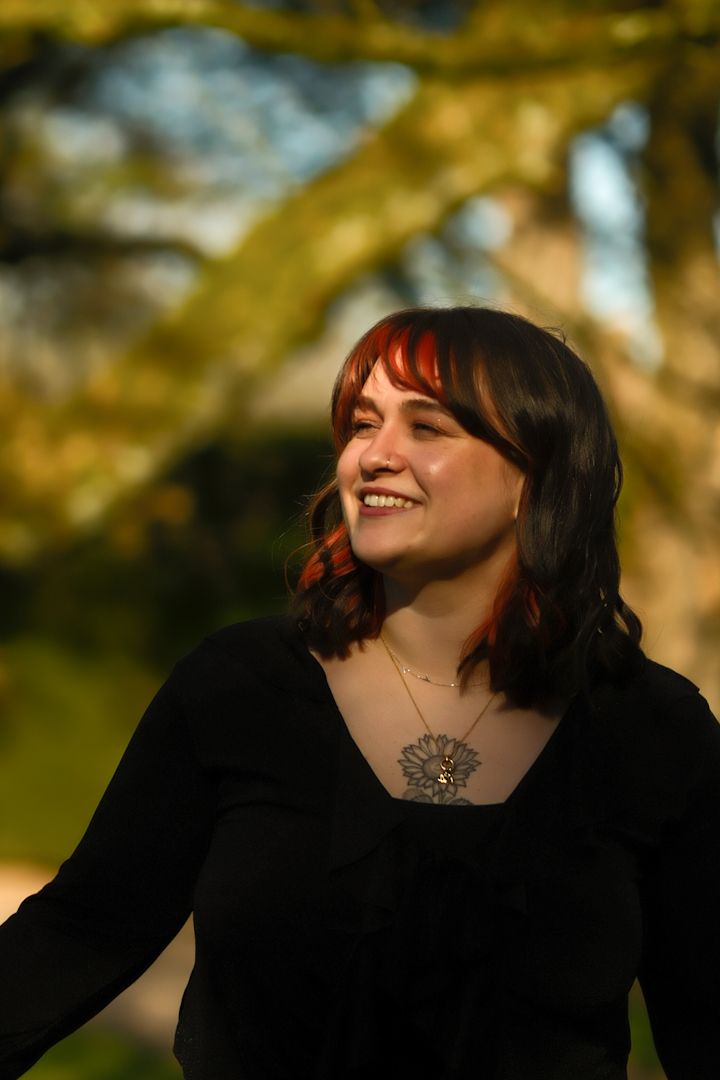 A sequence of artistic portraits showing someone in black clothing against a warm sunlit natural background.