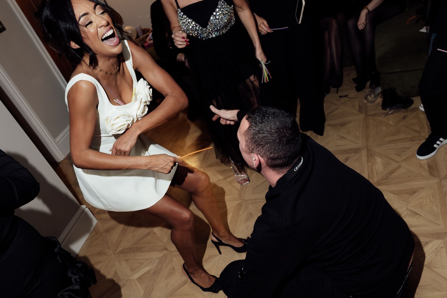 People dancing and celebrating at a lively indoor party.