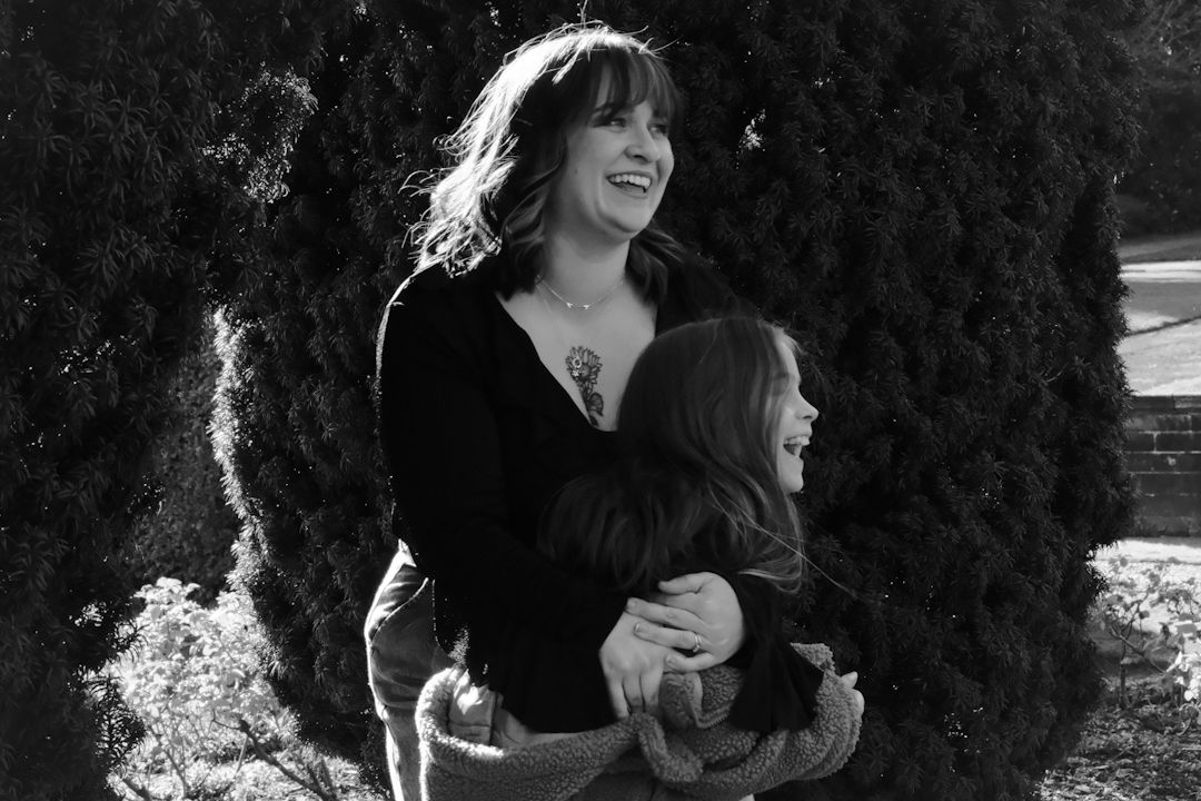 Black and white candid shots showing joyful moments against a dark background.