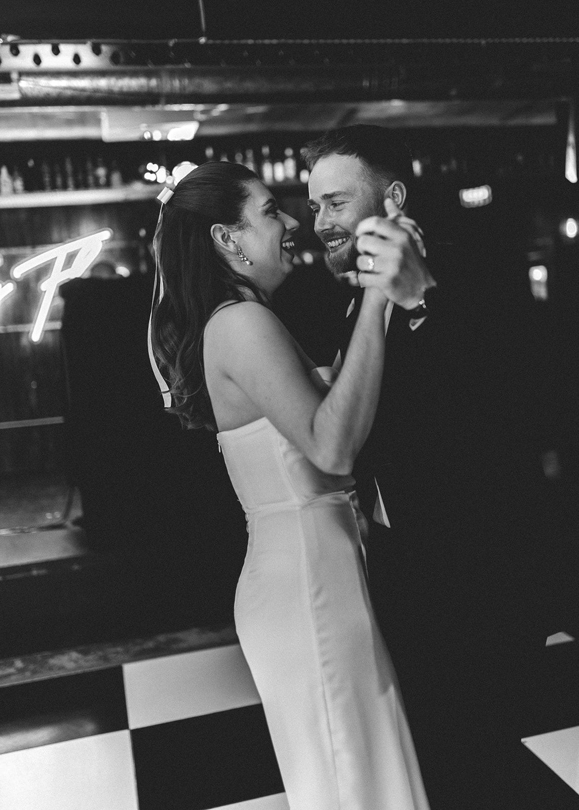 Black and white photo sequence showing a person in a white dress drinking from a glass at a bar counter.
