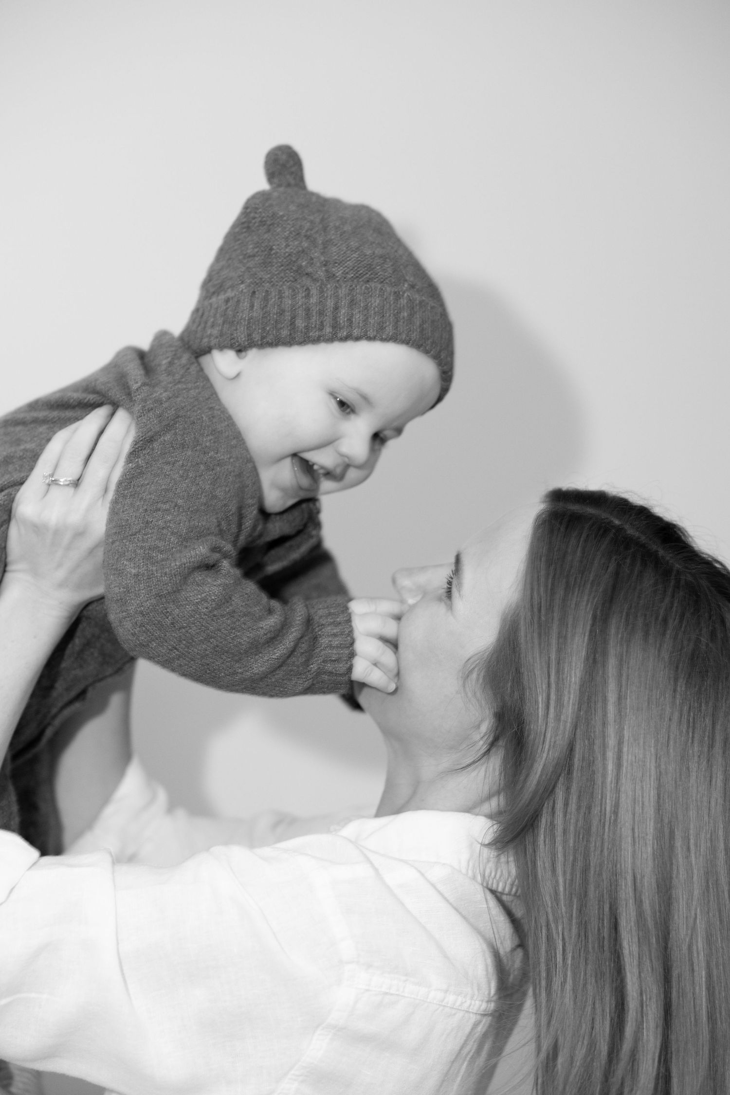 Black and white artistic photo series showing intimate close-up moments in soft lighting.