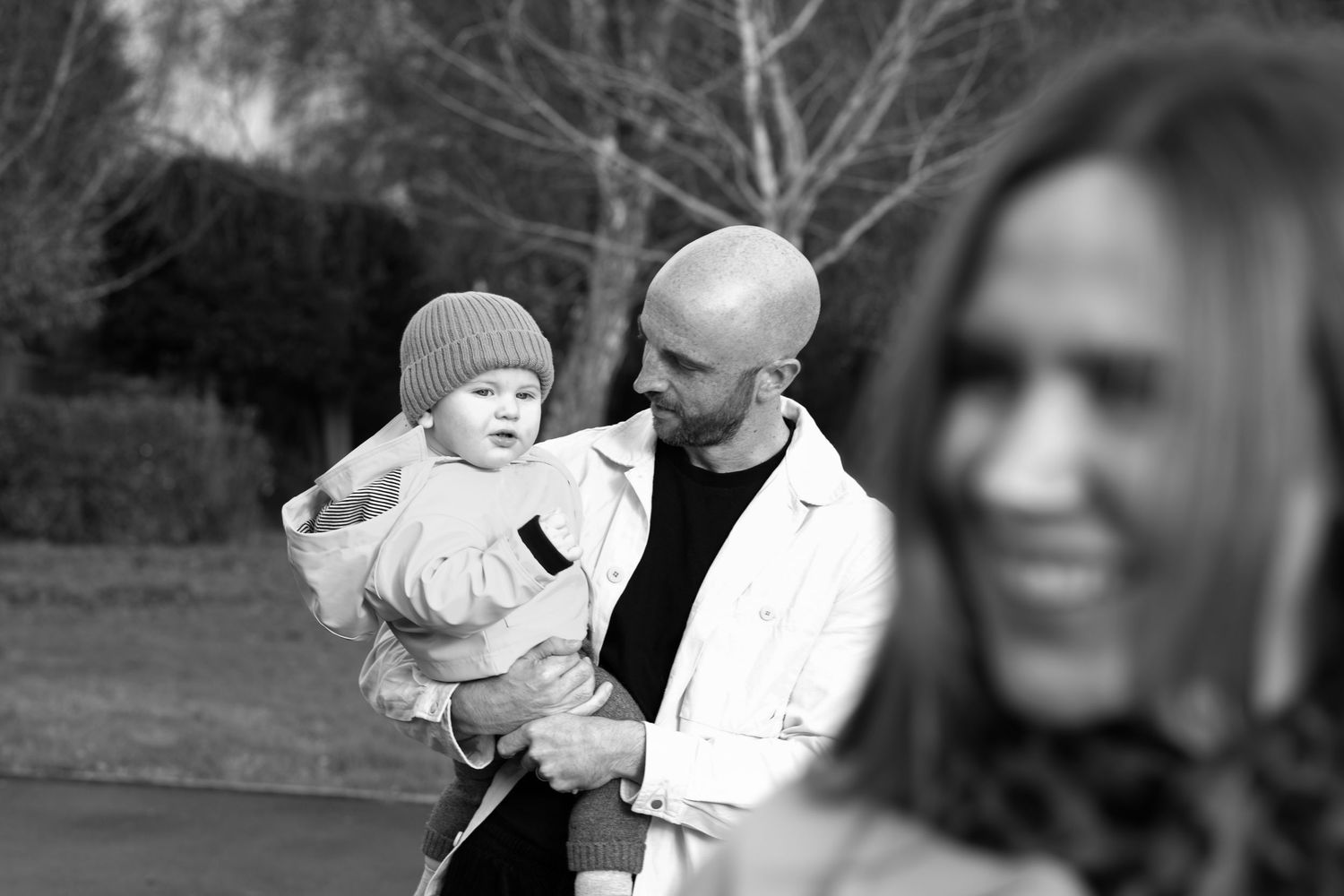 Black and white outdoor photography sequence showing winter moments with knit hats.