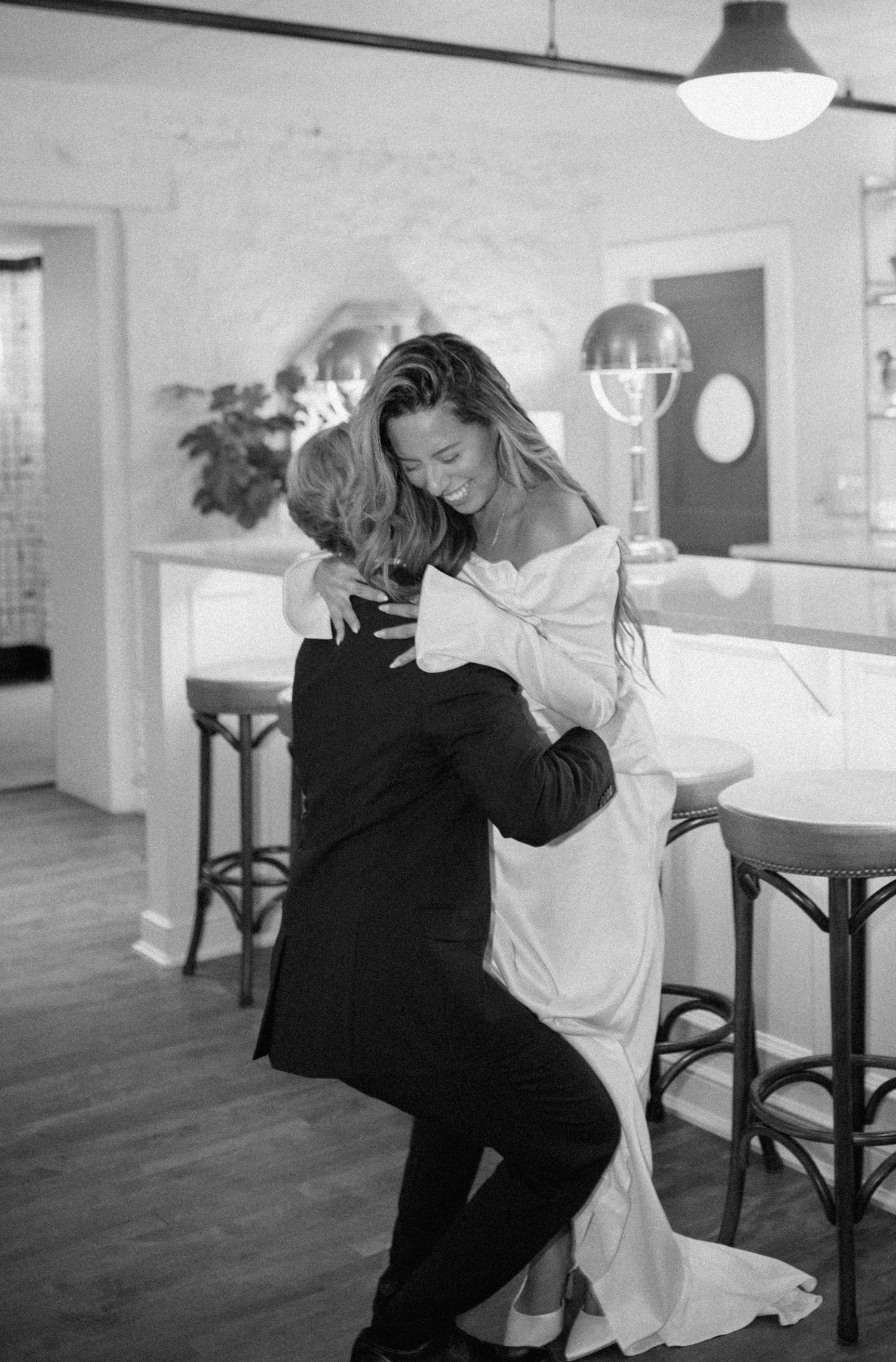 Candid dance sequence captured in a modern kitchen setting. Appleton, Green Bay & Kaukauna