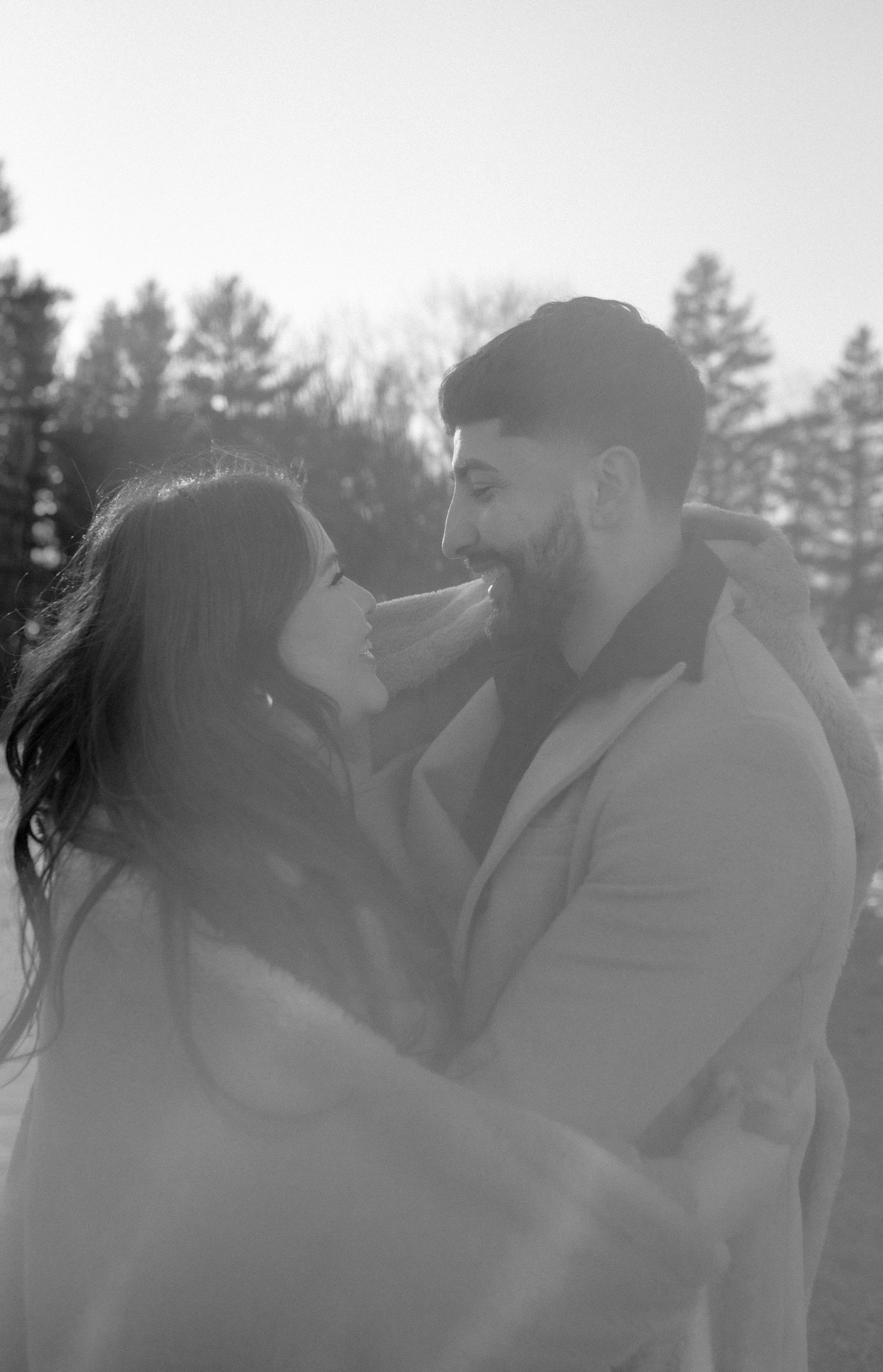 A romantic mist-filled photo series showing intimate moments between a couple in black and white.
