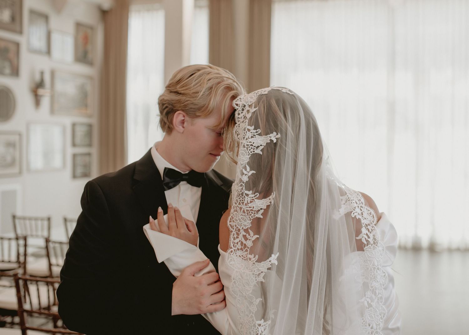 Intimate wedding moments captured in a bright indoor setting with classic decor.