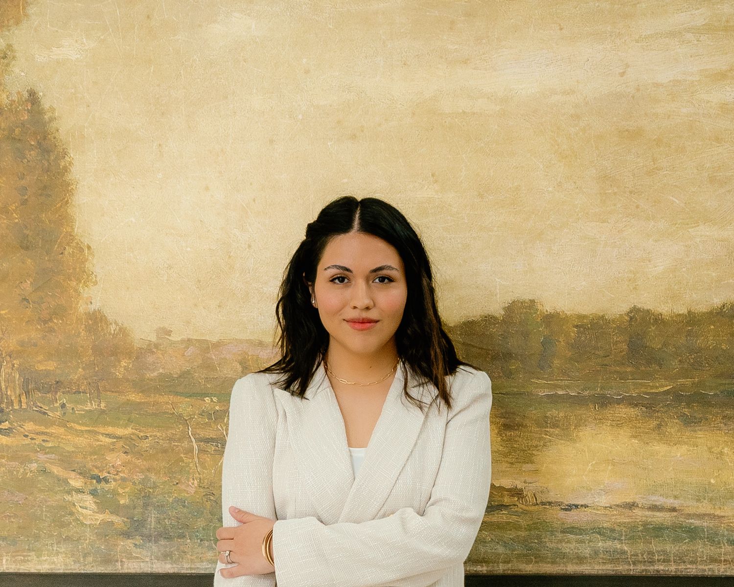 A series of professional portrait photos against a textured beige wall.