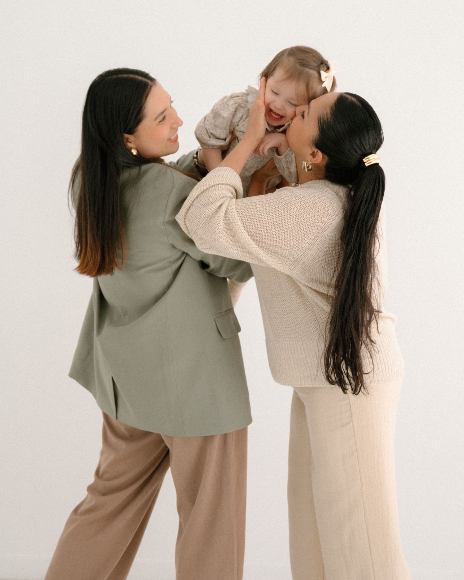 Candid family moments showing playful interaction against minimal white background.