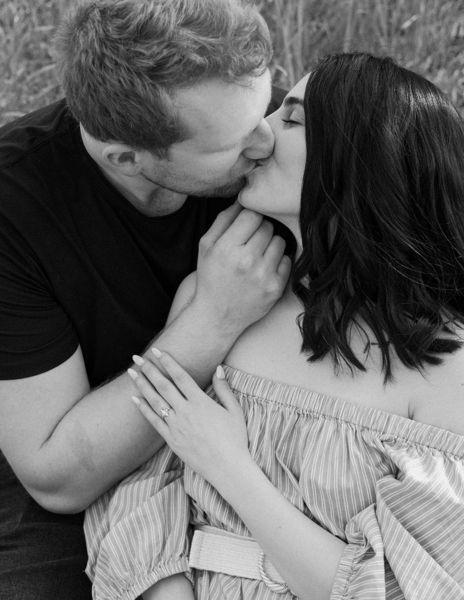 Black and white romantic portrait series showing tender moments between couple. Calgary Alberta Engagement Photographer