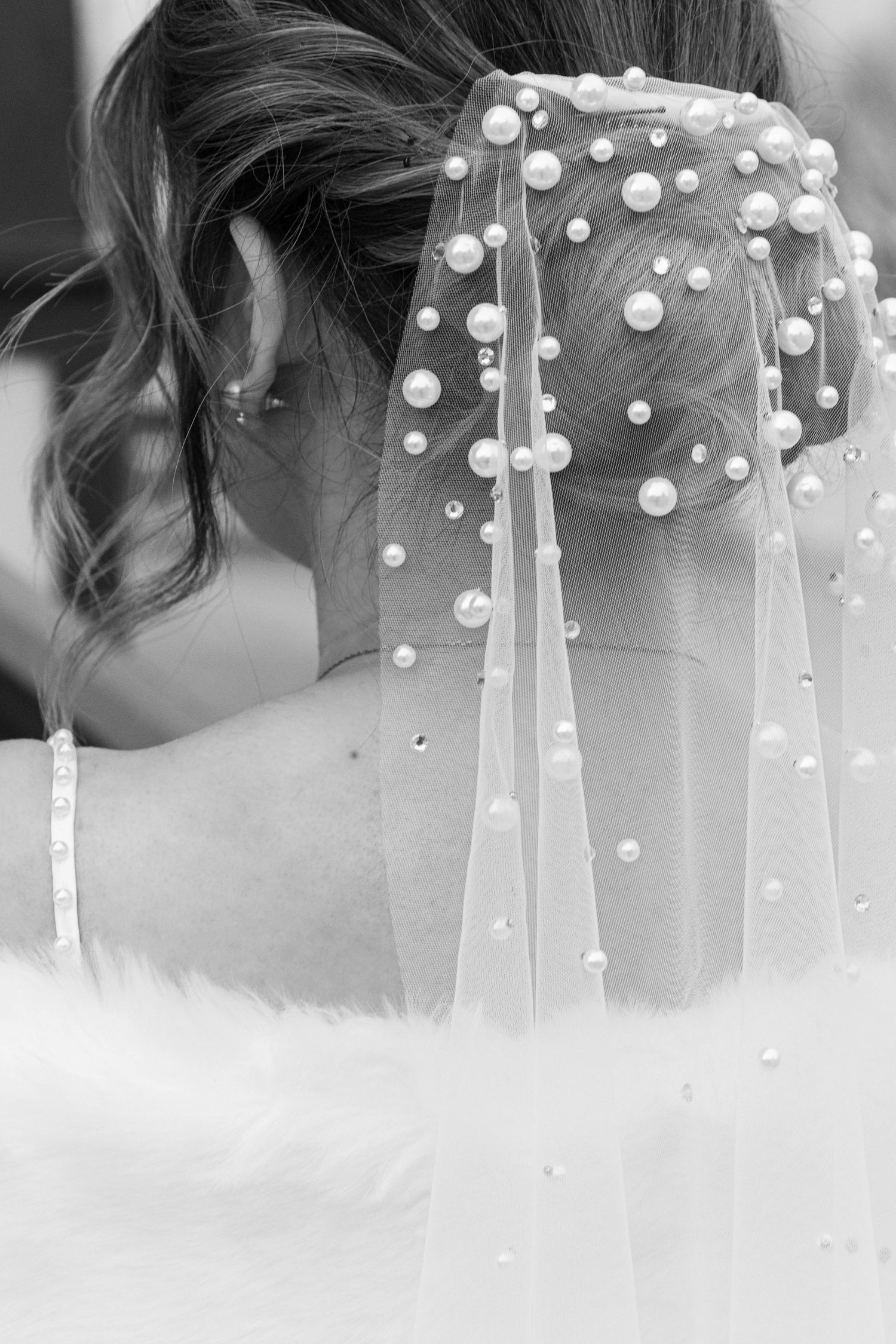Black and white detail shot of a pearl-adorned bridal veil. Calgary Wedding Photographer