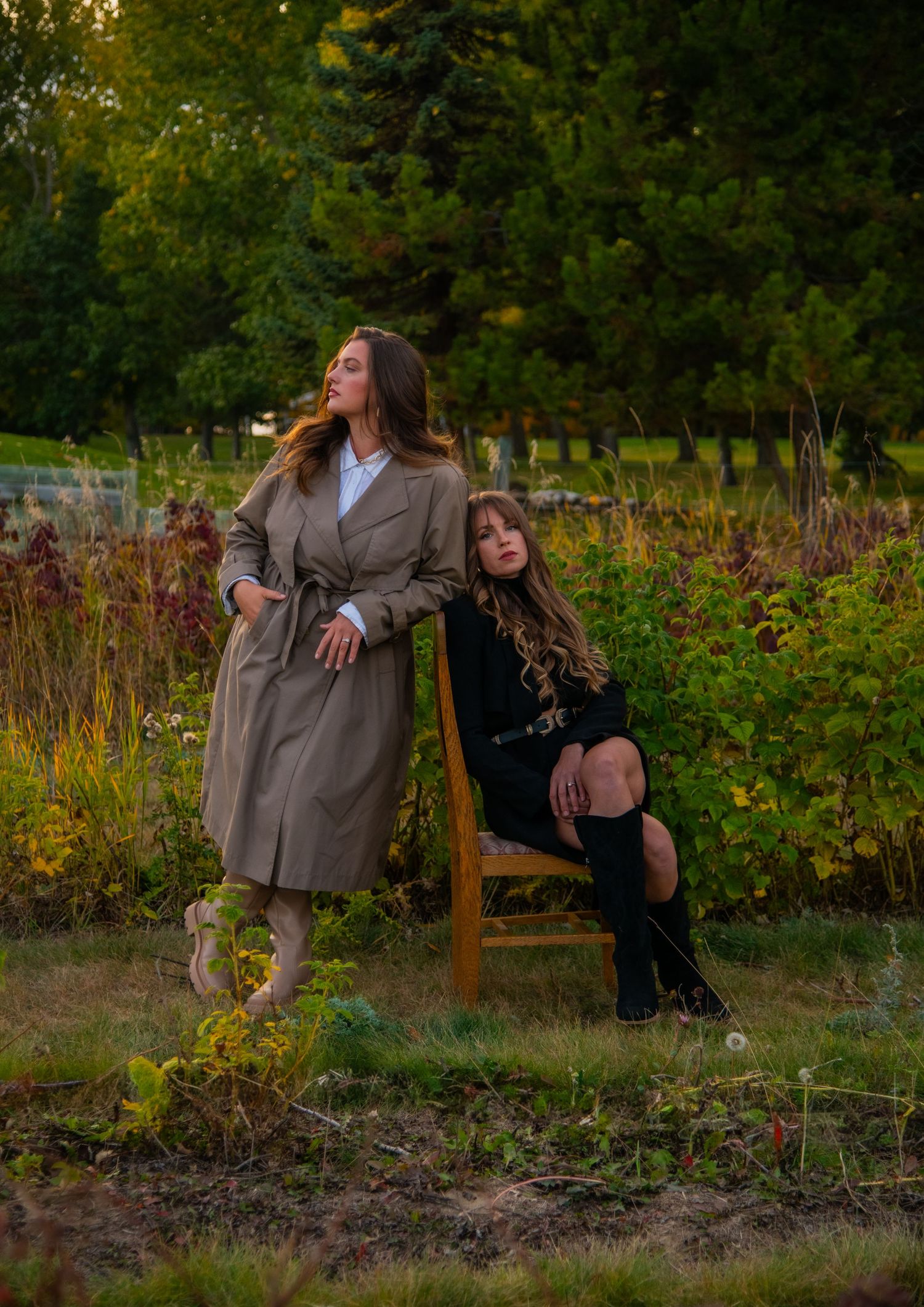 Two people sharing playful moments in a garden setting during golden hour. Calgary Branding Photographer