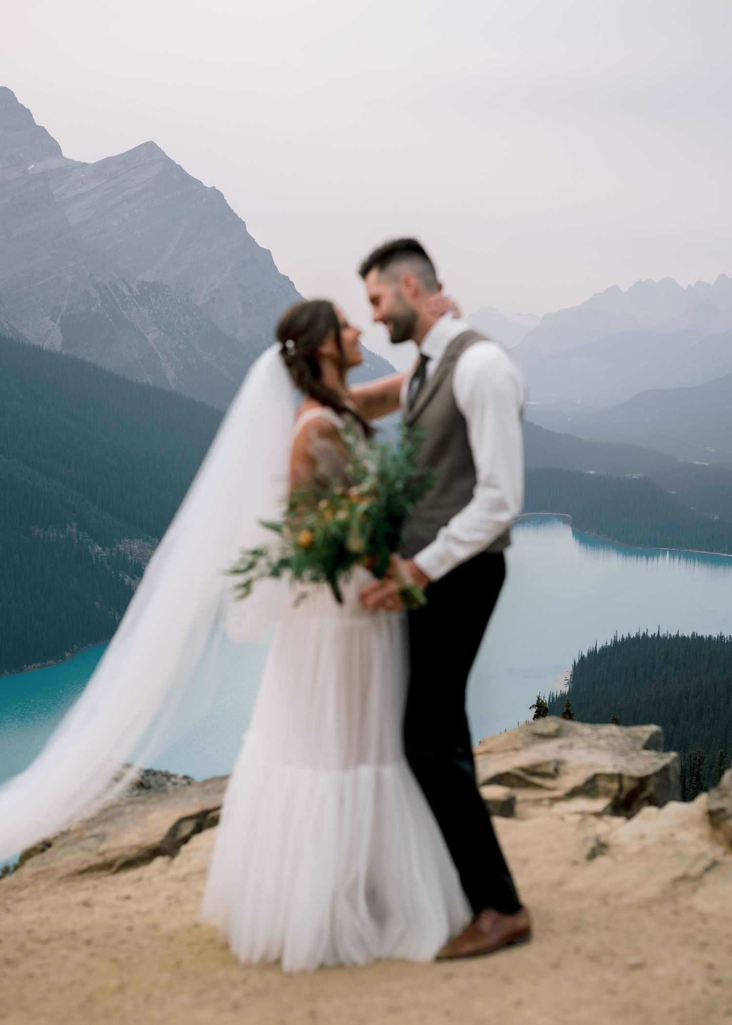 A romantic dance sequence unfolds against the backdrop of turquoise Peyto Lake and Canadian Rocky Mountains.