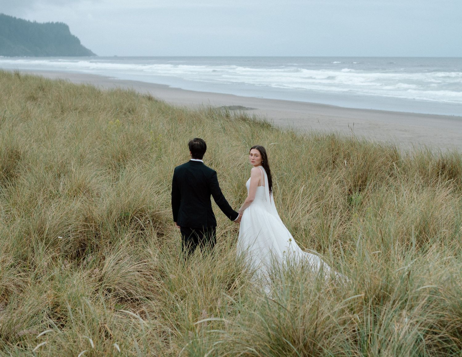 A series of romantic wedding photos taken on a misty beach with tall grass in Oregon.
