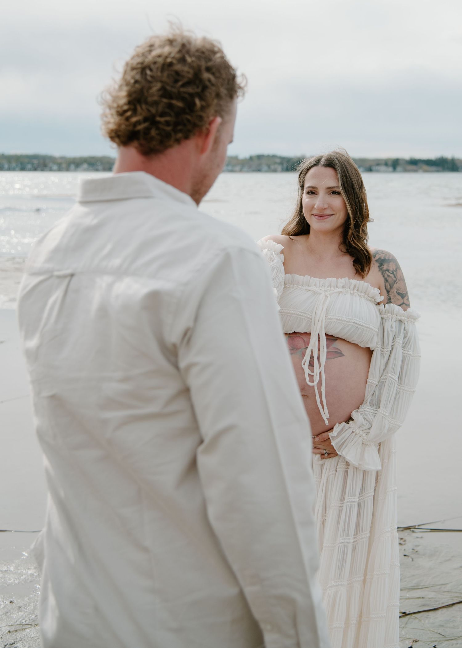 An intimate seaside portrait session featuring ethereal white clothing and natural lighting. Calgary Alberta Maternity Photographer.