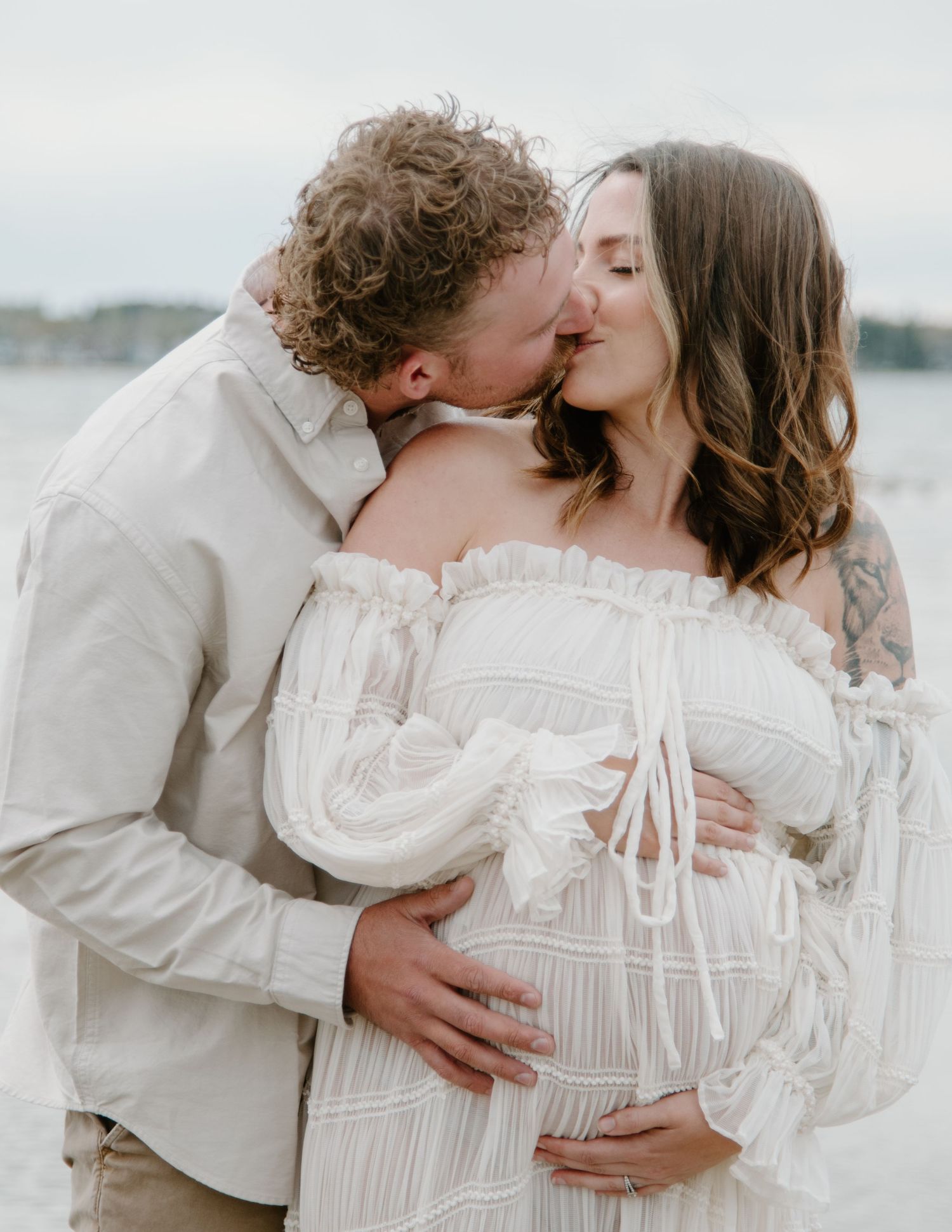 Romantic coastal maternity photographs showing tender moments between an expecting couple. Calgary Alberta Maternity Photographer.